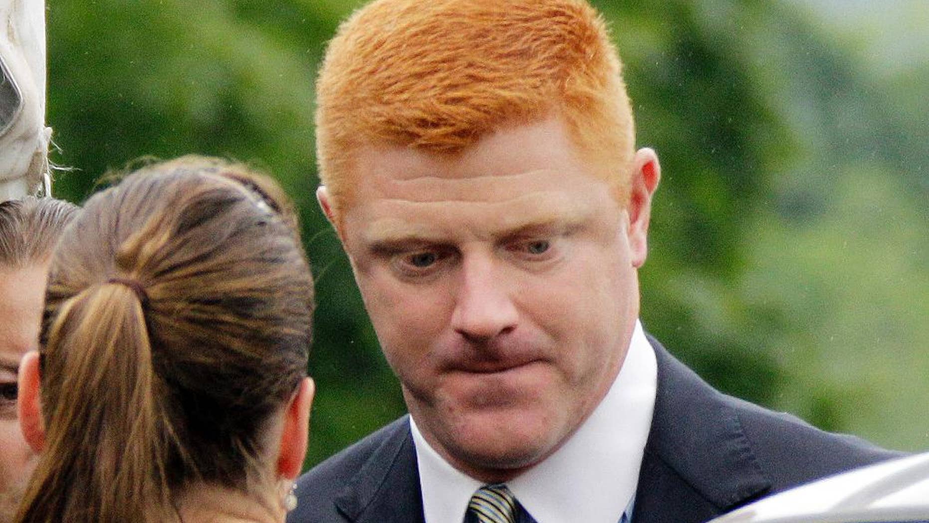 FILE - In this June 12, 2012, file photo, former Penn State University assistant football coach Mike McQueary arrives at the Centre County Courthouse in Bellefonte, Pa. McQueary's defamation and whistleblower lawsuit against Penn State over how it treated him for complaining about assistant football coach Jerry Sandusky sexually abusing a boy in a team shower is scheduled to go to trial Monday, Oct. 17, 2016, with opening statements in a courthouse near the university campus. (AP Photo/Gene J. Puskar, File)