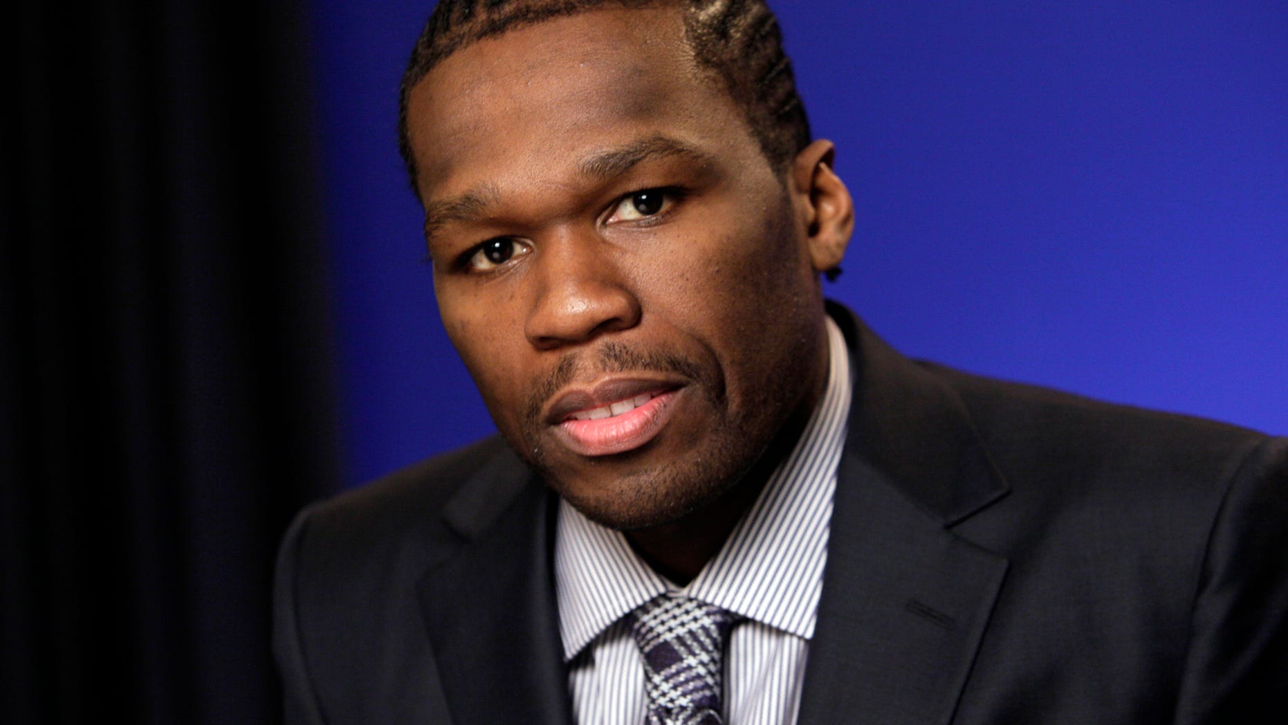 FILE - In this Oct. 26, 2011 file photo, Rapper and businessman Curtis Jackson III, known as 50 Cent, poses during an interview in New York. Rapper 50 Cent has lost a bid to end a Florida woman's lawsuit over a sex video posted online with him edited into it as a wig-wearing narrator. In a ruling made public Thursday, Jan. 2, 2014, a Manhattan judge rebuffed the rapper's request to dismiss Lastonia Leviston's suit. Lawyers for both sides haven't immediately returned calls. (AP Photo/Richard Drew, File)