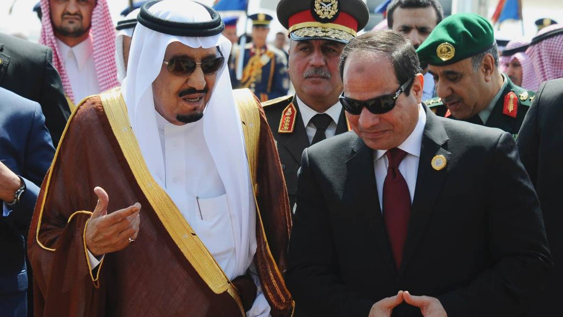 FILE -- In this March 28, 2015 file photo provided by Egypt's state news agency MENA, Egyptian President Abdel-Fattah el-Sissi, right, talks with Saudi King Salman after the king arrived in Sharm el-Sheikh, Egypt. Close allies Egypt and Saudi Arabia are having their first public spat since Egyptian President Abdel-Fattah el-Sissi took office two years ago. The disagreement is over Syria, where Riyadh says Syrian President Bashar Assad must be removed for that country's civil war to end, while Cairo advocates a political process that denies Islamic militants any role in Syria's future. Egypt voted in favor of separate Russian and French draft resolutions on Syria at the U.N. Security Council on Saturday, Oct. 8, 2016. (MENA via AP, File)