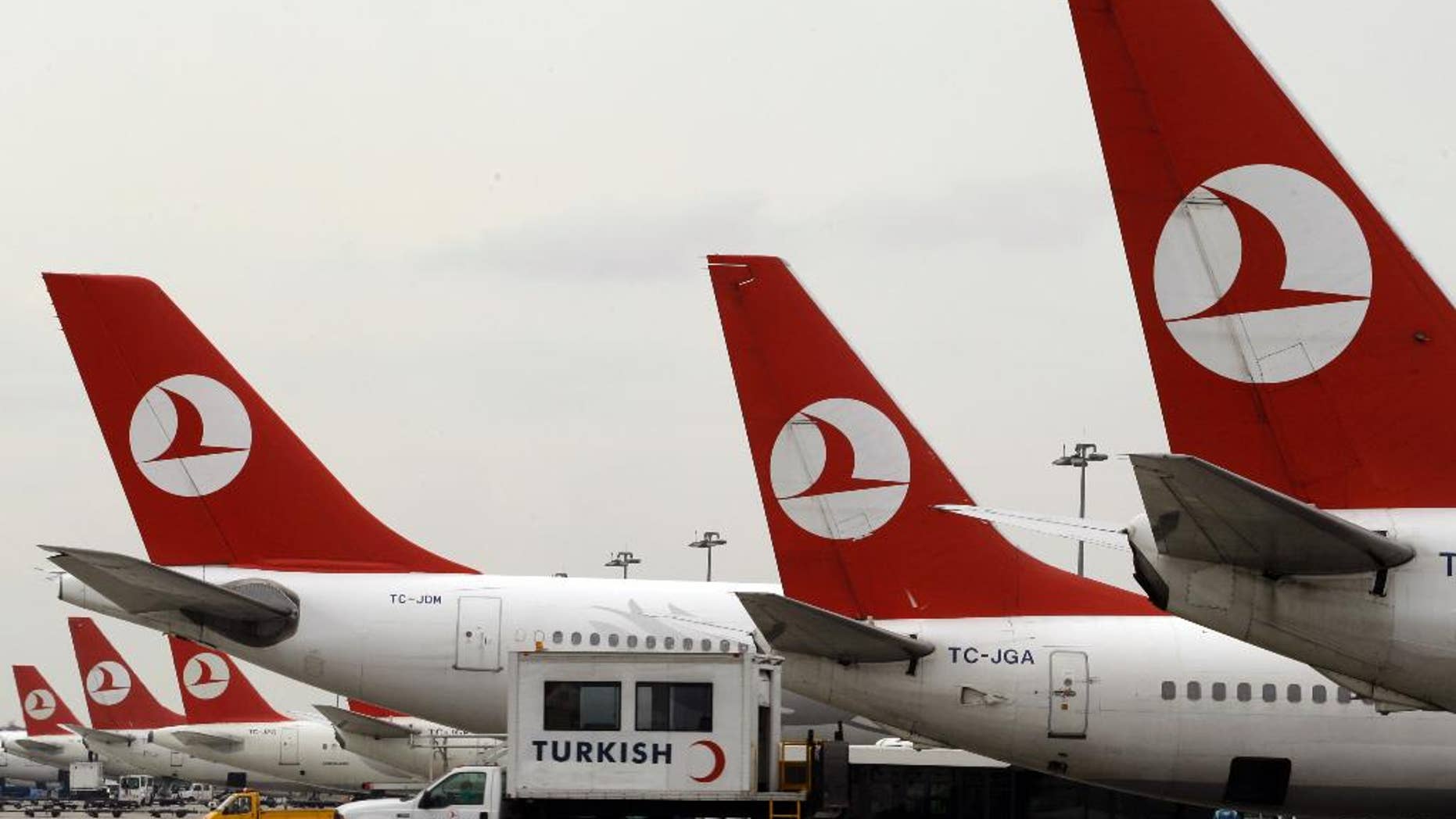FILE - In this Dec. 27, 2008, file photo, Turkish Airlines aircraft are seen on the tarmac at the Ataturk International airport in Istanbul, Turkey. The airline shared pictures on social media Friday, April 7, 2017,
of cabin crew with a baby the airline said they helped deliver during a flight over West Africa last week.
(AP Photo/Ibrahim Usta, File)