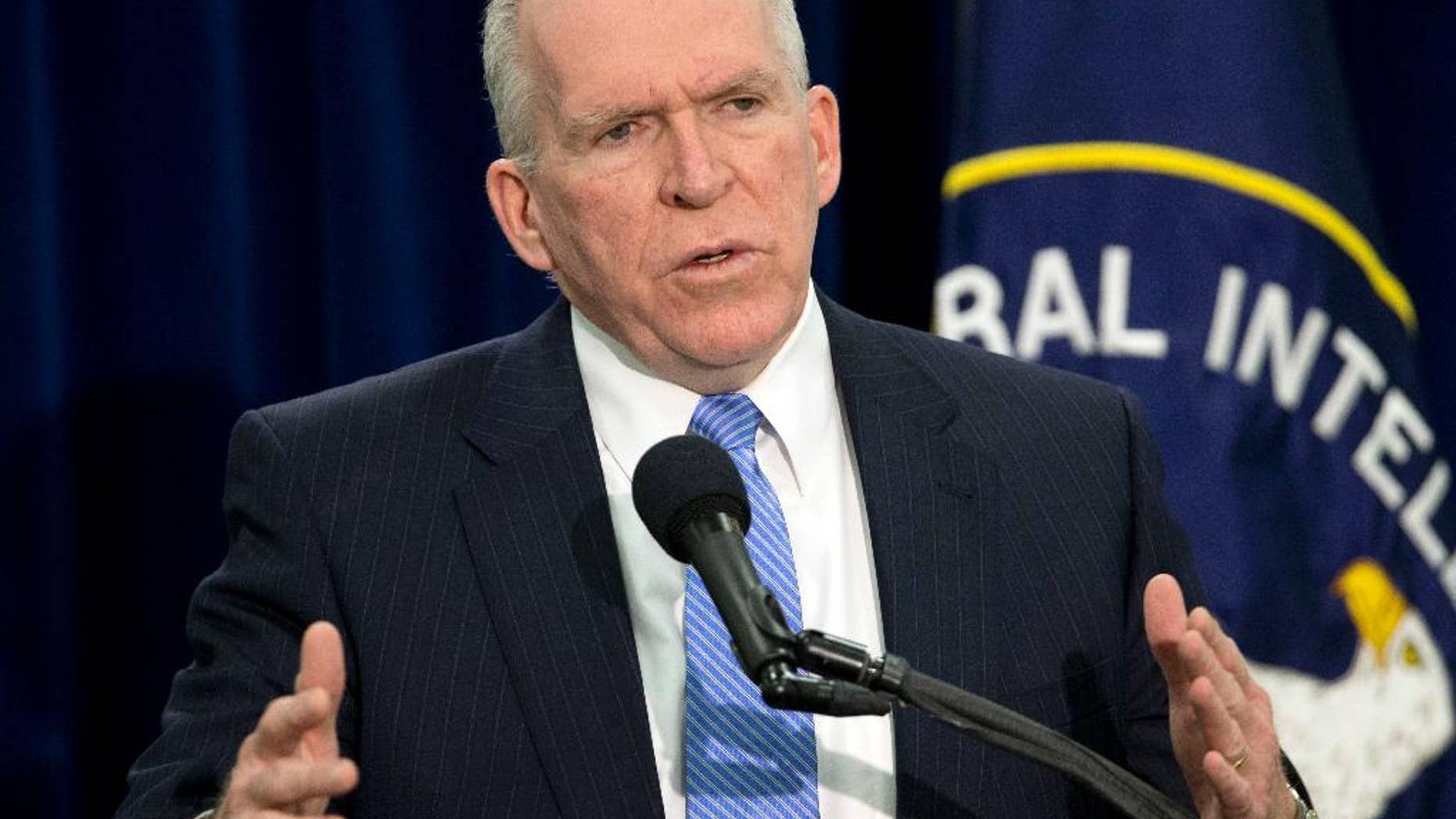 FILE - In this Dec. 11, 2014, file photo, CIA Director John Brennan speaks during a news conference at CIA headquarters in Langley, Va. Newly declassified documents offer more details about a detainee who died inside the secret prison network the CIA operated abroad after the Sept. 11 attacks and disclose that President George W. Bush was worried about the image of shackled detainees wearing adult diapers. Brennan has said that the agency made mistakes and learned from them, but insisted the coercive techniques used on detainees produced intelligence "that helped thwart attack plans, capture terrorists and save lives."(AP Photo/Pablo Martinez Monsivais, File)