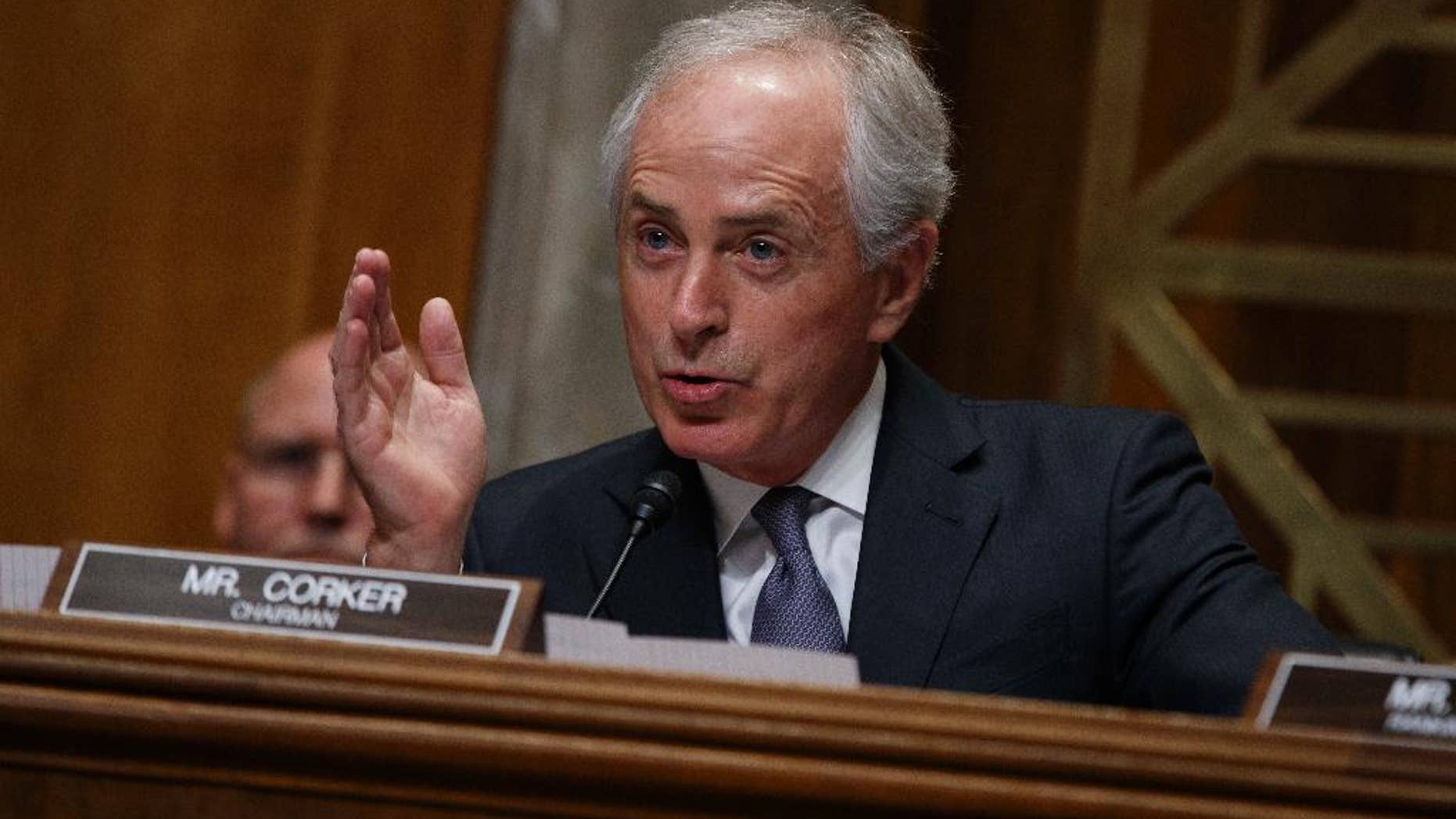 FILE - In this Wednesday, Jan. 18, 2017, file photo, Sen. Bob Corker, R-Tenn., the chairman of the Foreign Relations Committee, speaks on Capitol Hill in Washington during the committee's confirmation hearing for UN Ambassador-designate, South Carolina Gov. Nikki Haley. When President Donald Trump paused the nation's refugee program with the stroke of a pen, top congressional leaders of his own party were left to find out the same way the general public did: from the media as Trump signed the order. Corker told reporters Monday, Jan. 30: "I guess one of you guys probably told me about it. Thank you for that." Lawmakers complained that they were left in the dark as details of the plan were worked out. (AP Photo/Evan Vucci, File)