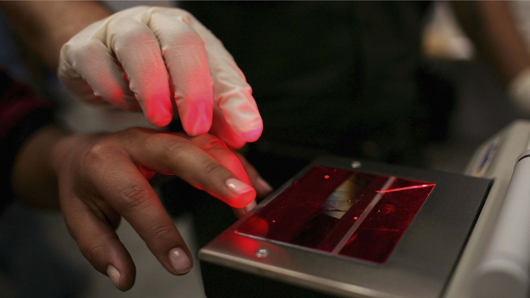 NOGALES, AZ - JUNE 21: A woman gets her fingerprints taken after she was caught crossing the U.S. border with Mexico illegally, at the U.S. Border Patrol processing center June 21, 2006 in Nogales, Arizona. President Bush plans to deploy a total 6,000 National Guard soldiers in the four southern border states in an attempt to mitigate illegal immigration into America. Detentions along the U.S.-Mexico border decreased by 21 percent to 26,994, in the first 10 days of June according to U.S. authorities compared. (Photo by Spencer Platt/Getty Images)
