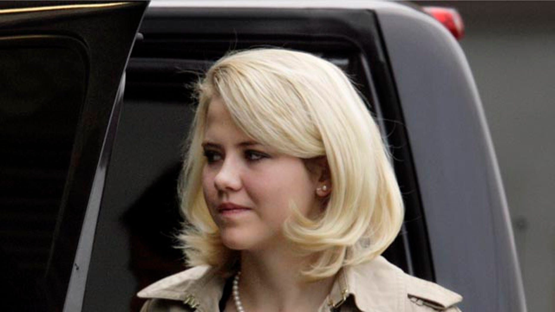 Nov. 10: Elizabeth Smart is escorted into Frank Moss Federal Courthouse in Salt Lake City to testify in the trial of her kidnapper Brian David Mitchell.