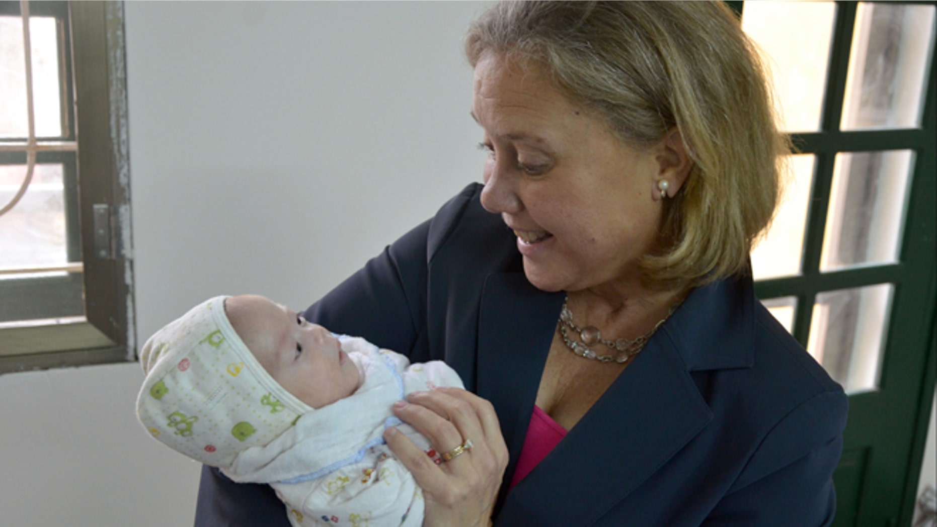Feb. 20, 2013: Sen. Mary Landrieu, D-La., holds an infant during a visit to the Phu My Village orphanage in Vietnam.