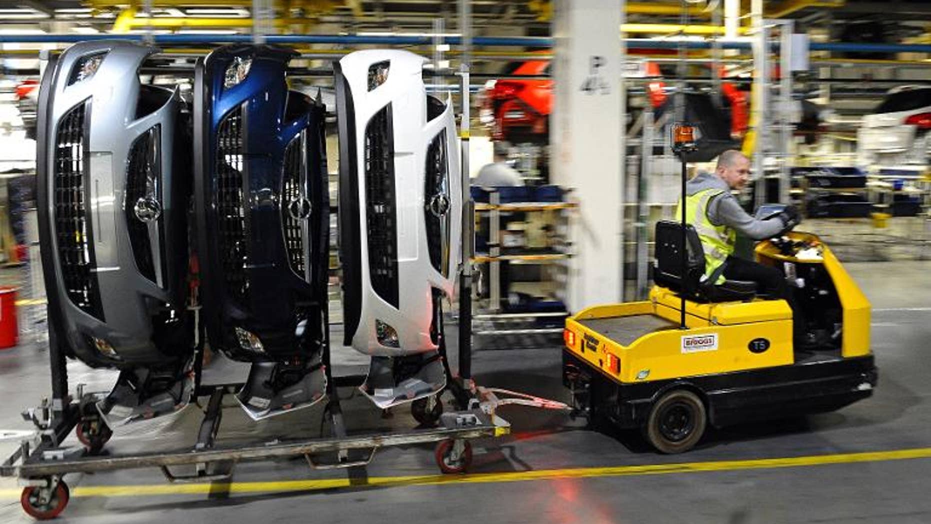 Vehicle parts for Vauxhall and Opel Astra cars are transported on the production line at the Vauxhall car factory in Ellesmere Port, northwest England, on May 17, 2012.