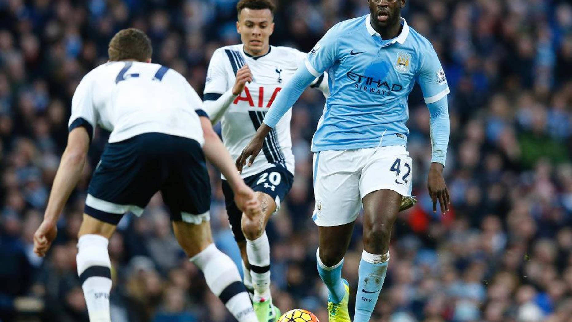FILE - This is a Sunday Feb. 14, 2016 file photo of Manchester City's Yaya Toure, right, as he runs with the ball during the English Premier League soccer match between Manchester City and Tottenham Hotspur's at the Etihad Stadium in Manchester, England. It was one of the great sights of English soccer in recent years, Toure picking up possession in central midfield for Manchester City, and rampaging upfield but now he can found sitting in front of City’s defense, reading the game, dictating its tempo, picking off opposition passes and starting attacks. (AP Photo/Jon Super, File)