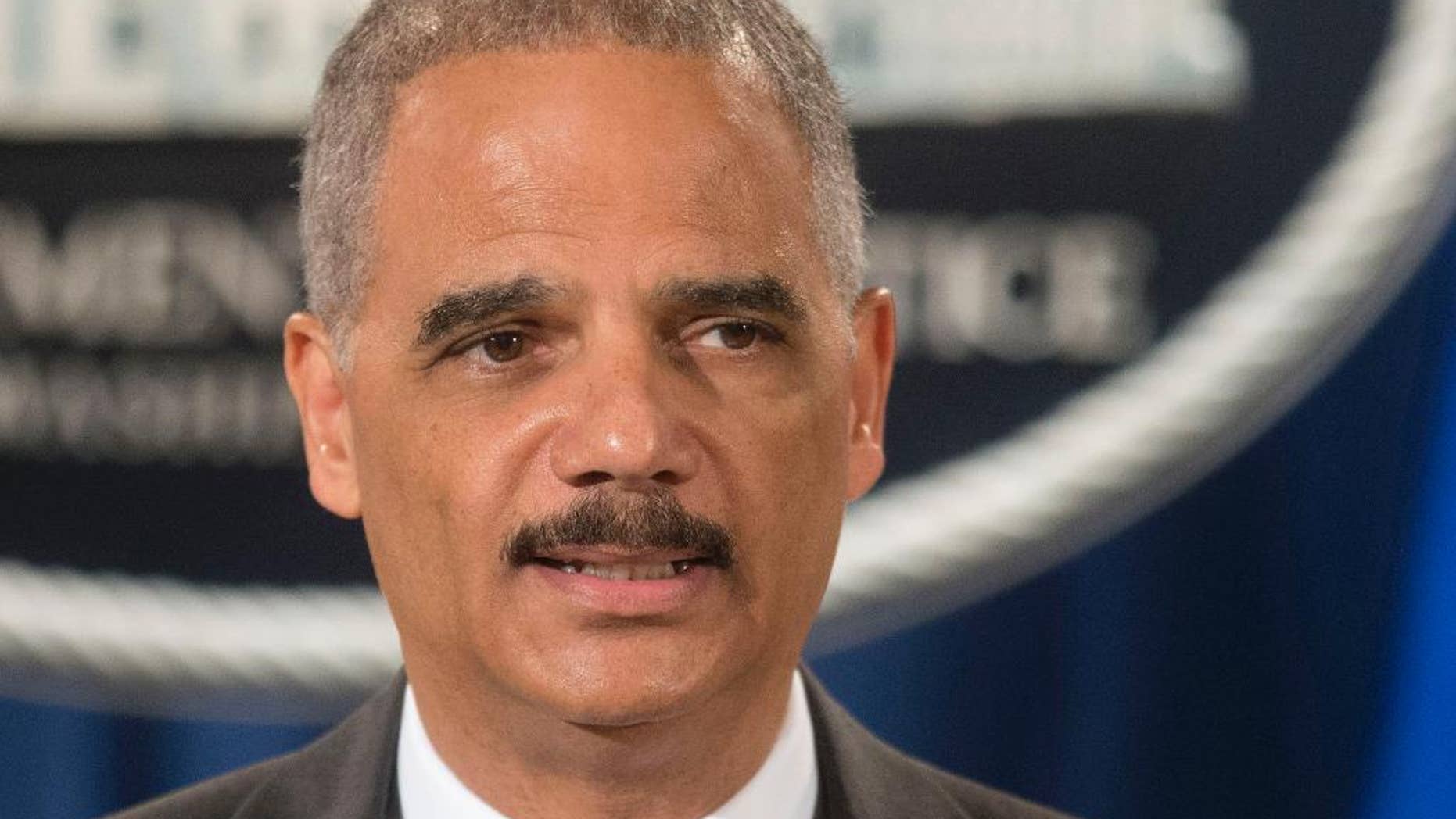 FILE - This July 14, 2014 file photo shows Attorney General Eric Holder speaking at the Justice Department in Washington. Holder said Thursday he's concerned about police use of military equipment in Ferguson, Mo. (AP Photo/Pablo Martinez Monsivais, File)