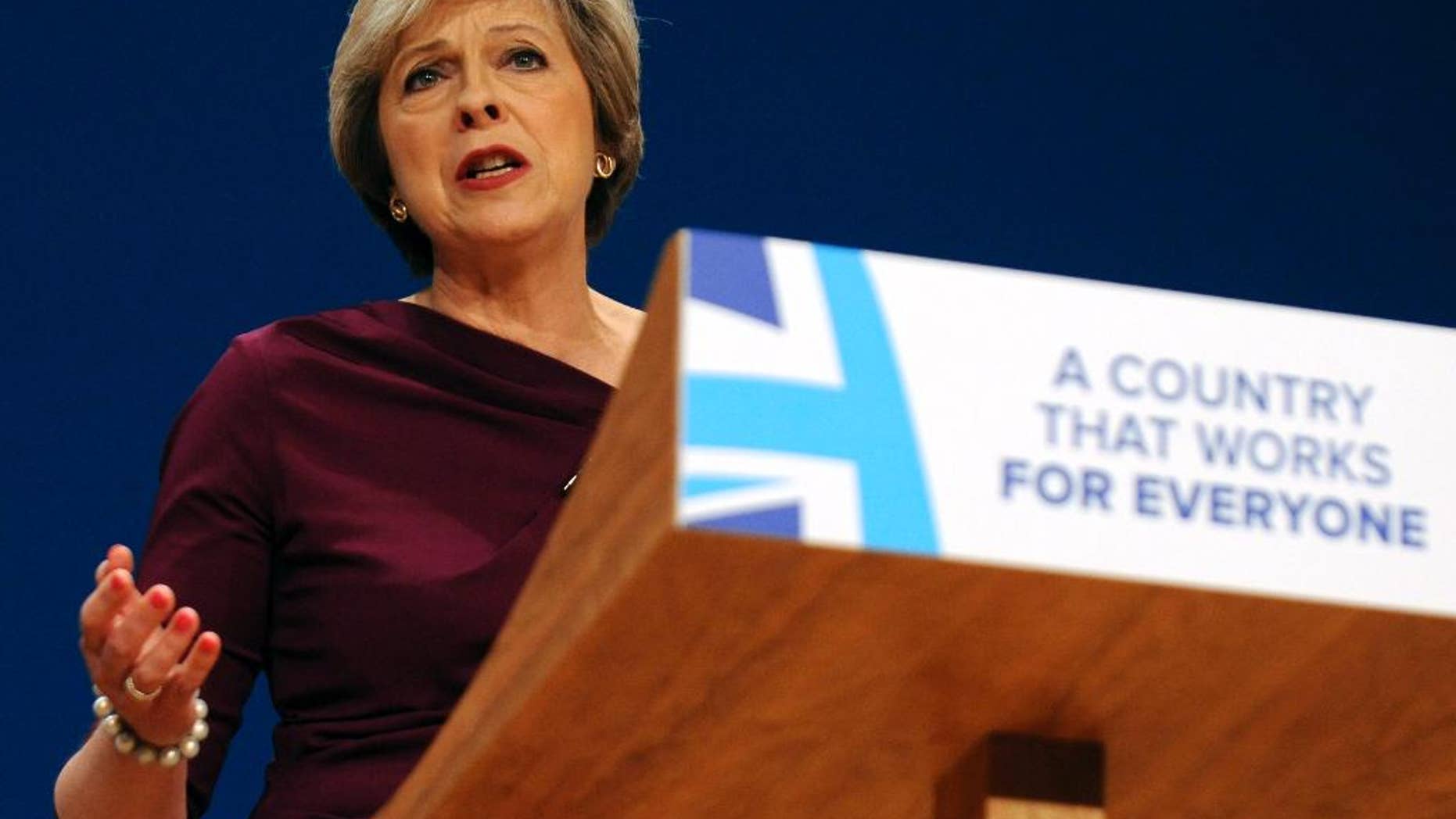 FILE - In this Wednesday, Oct. 5, 2016 file photo, Conservative Party Leader and Prime Minister Theresa May addresses delegates at the Conservative Party Conference at the ICC, in Birmingham, England. The pound has dropped more than 5 percent against the dollar since Oct. 2, when Prime Minister Theresa May announced plans to start formal talks on exiting the European Union by the end of March. (AP Photo/Rui Vieira, file)