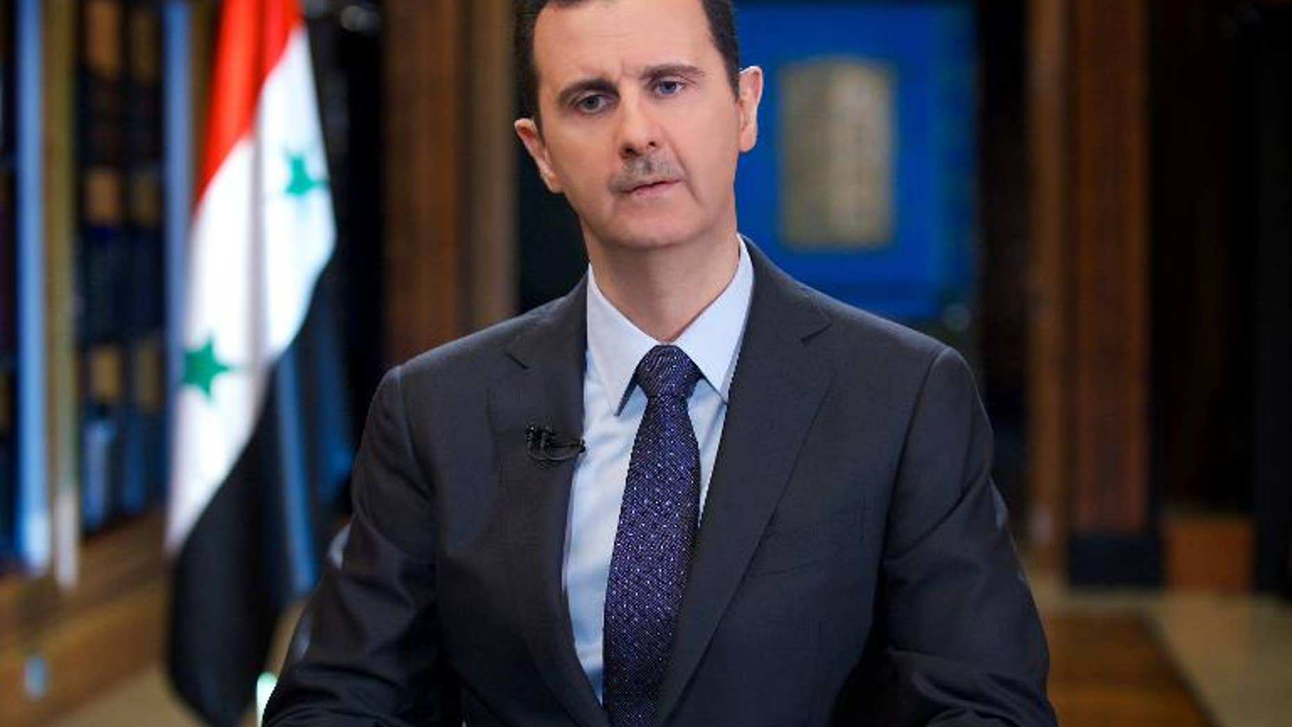 Syrian President Bashar al-Assad gives an interview with Venezuelan television station TeleSUR in Damascus, in a picture released by the official Syrian Arab News Agency on September 25, 2013