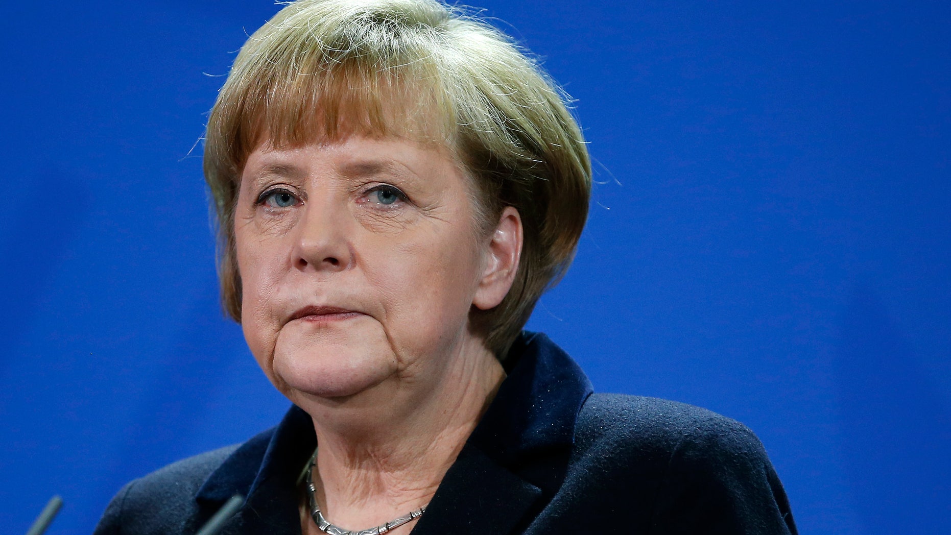 German Chancellor Angela Merkel attends a joint press conference with the Prime Minister of Greece, Andonis Samaras, after a meeting at the chancellery in Berlin, Germany, Friday, Nov. 22, 2013. (AP Photo/Michael Sohn)