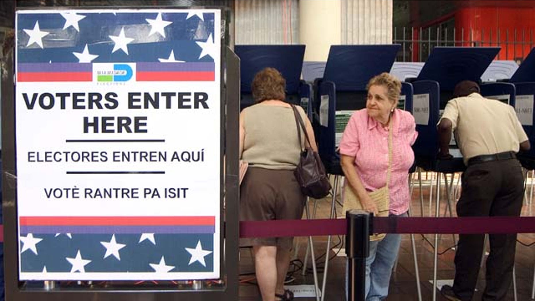 MIAMI - OCTOBER 21: Hispanic voters go to the polls for early voting at the Miami-Dade Government Center on October 21, 2004 in Miami, Florida. Early voting began this week in Florida and is under heavy scrutiny after the debacle in the 2000 election. (Photo by G. De Cardenas/Getty Images)