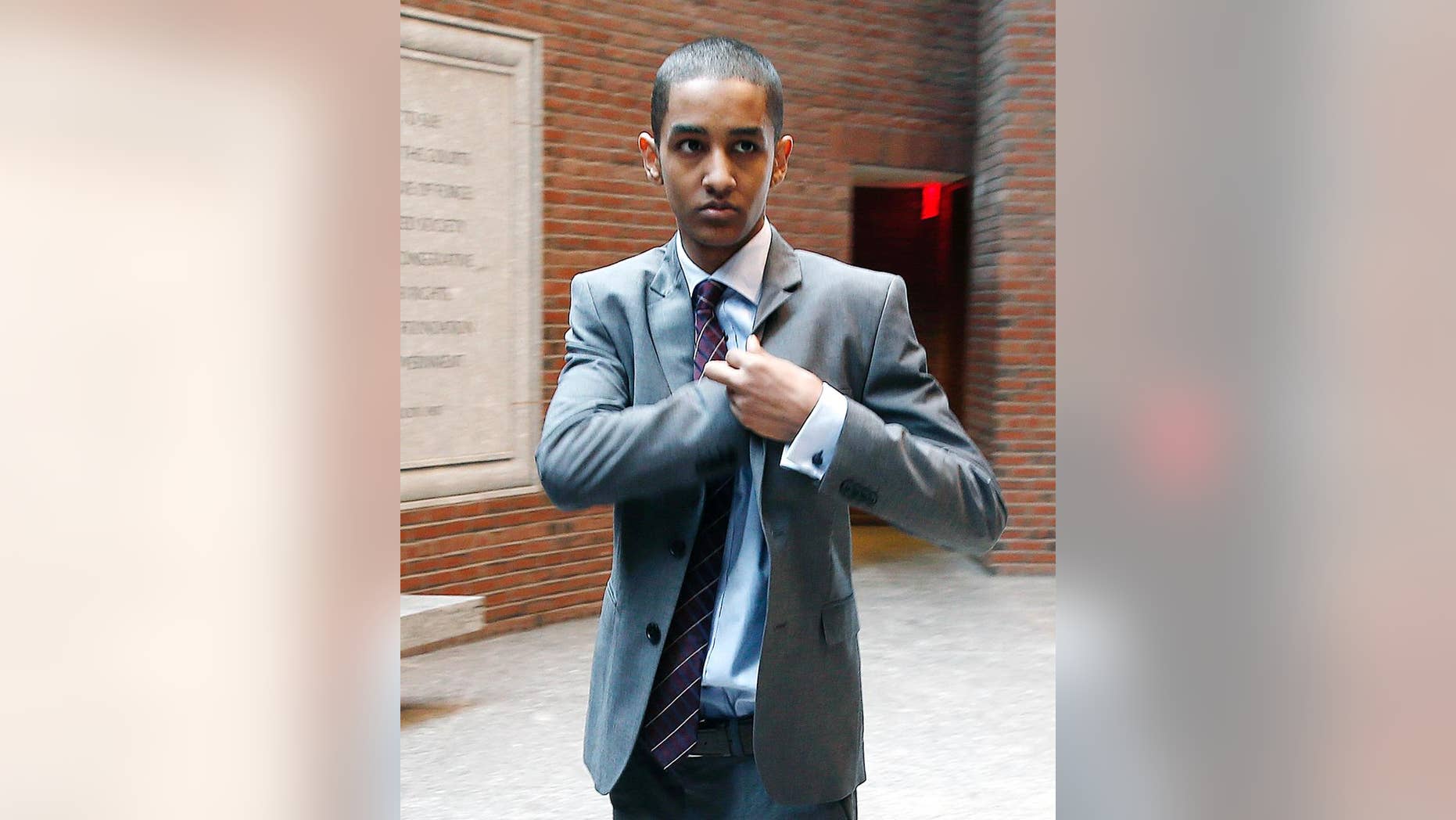 FILE - In this Sept. 29, 2014 file photo, Robel Phillipos arrives at federal court in Boston for the start of jury selection for his trial in connection with the Boston Marathon bombings. Opening statements are scheduled for Monday, Oct. 6, 2014, in Phillipos trial. He was charged with lying to authorities about being in Boston Marathon bombing suspect Dzhokhar Tsarnaev's dorm room while two other friends removed Tsarnaev’s backpack, laptop and other items. (AP Photo/Michael Dwyer, File)