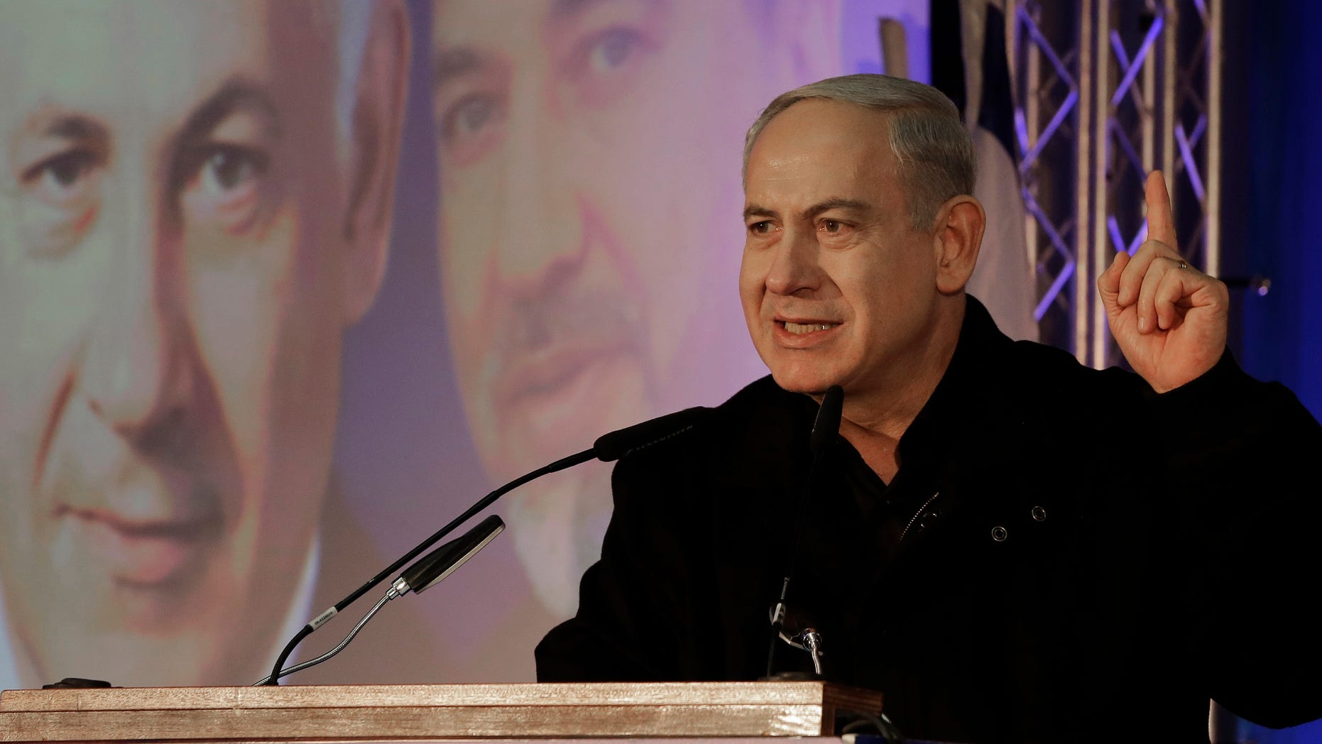 Prime Minister Benjamin Netanyahu speaks during a Likud-Yisrael Beitenu campaign rally in the port city of Ashdod, Wednesday, Jan. 16, 2013. Legislative elections in Israel will be held on Jan. 22, 2013. (AP Photo/Tsafrir Abayov)