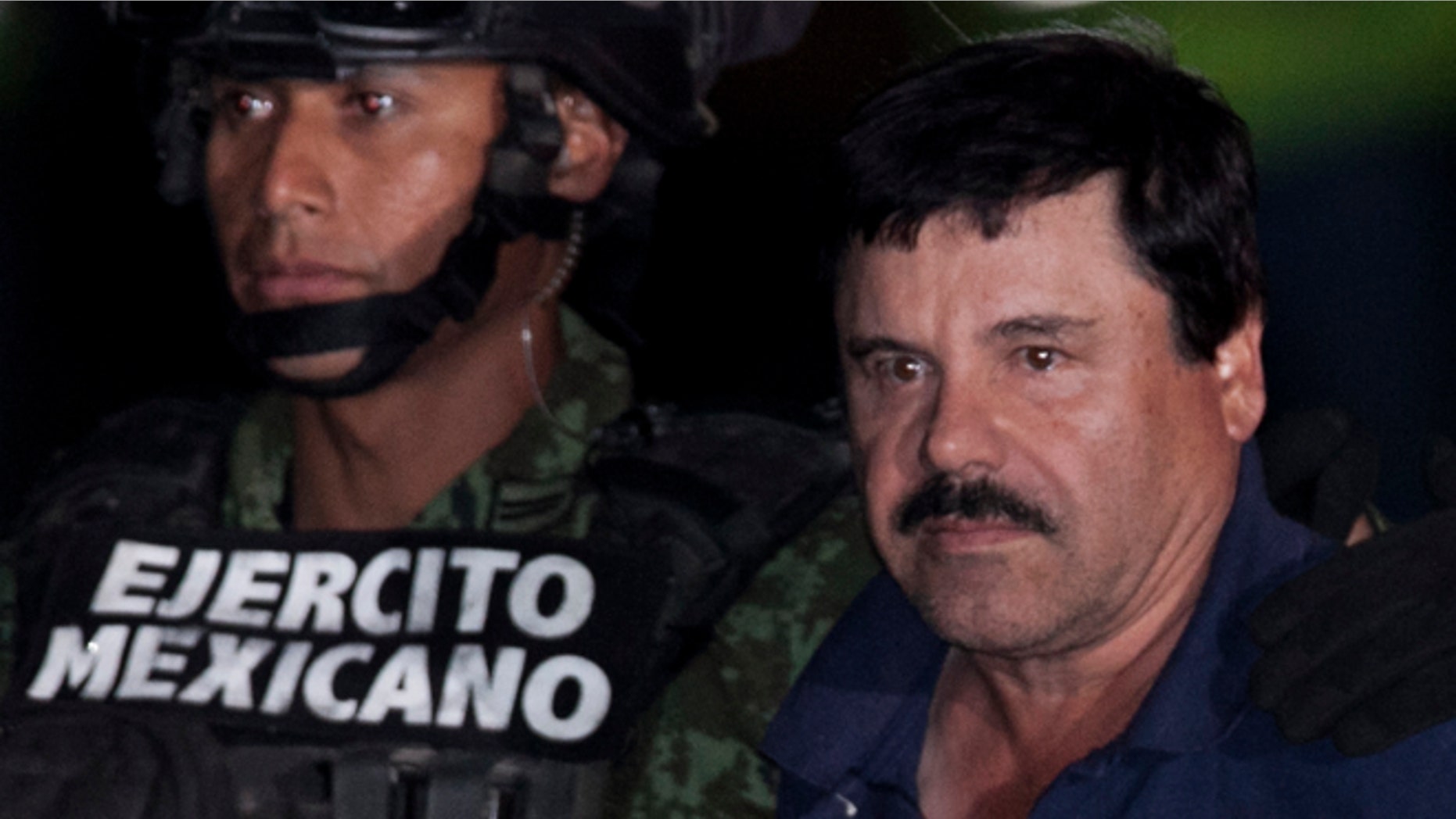 Joaquín Guzmán is escorted by soldiers and marines in Mexico City, Friday, Jan. 8, 2016.