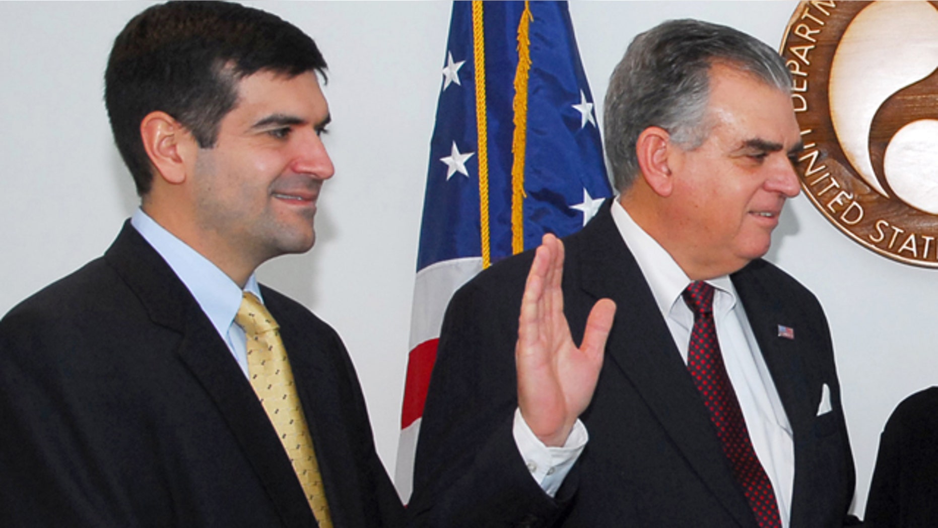 In this Jan. 23, 2009, file photo, Sam Lahood stands by as his father, Ray LaHood, is sworn in as transportation secretary.