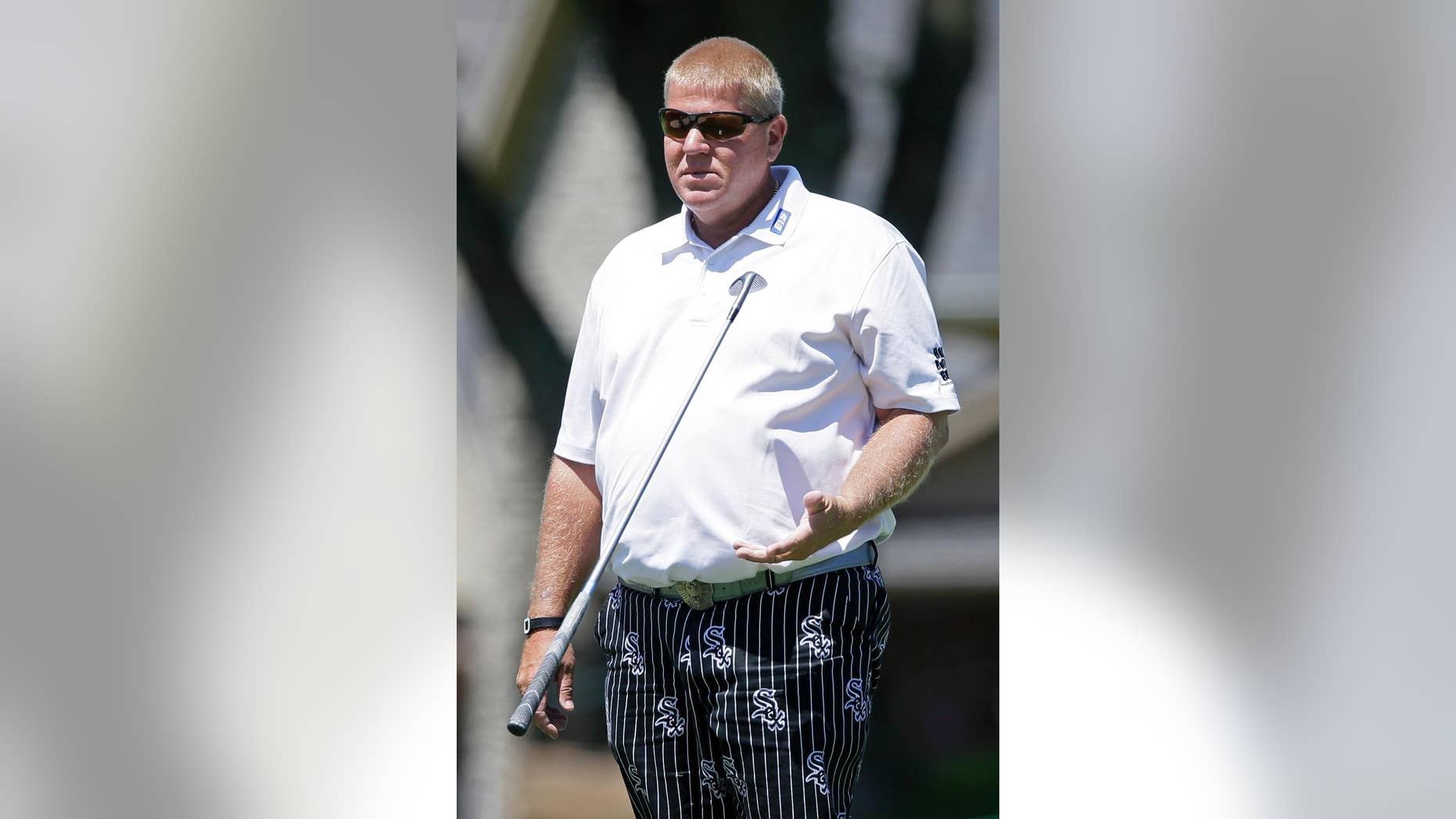 FILE - In this June 3, 2016, file photo, John Daly flips his putter after missing a birdie putt on the fifth green during the first round of the PGA Tour Champions Principal Charity Classic golf tournament, in Des Moines, Iowa. Daly has thrown golf clubs during fits of frustration over the course of his wild career. He says his putter going into a lake at a PGA Tour Champions event last week was not one of them. “If I throw a putter, it’s going to be in two pieces, not one,” Daly said Wednesday, Feb. 15, 2017. “And it’s going to be 50 yards in the lake, not 5.”(AP Photo/Charlie Neibergall, File)