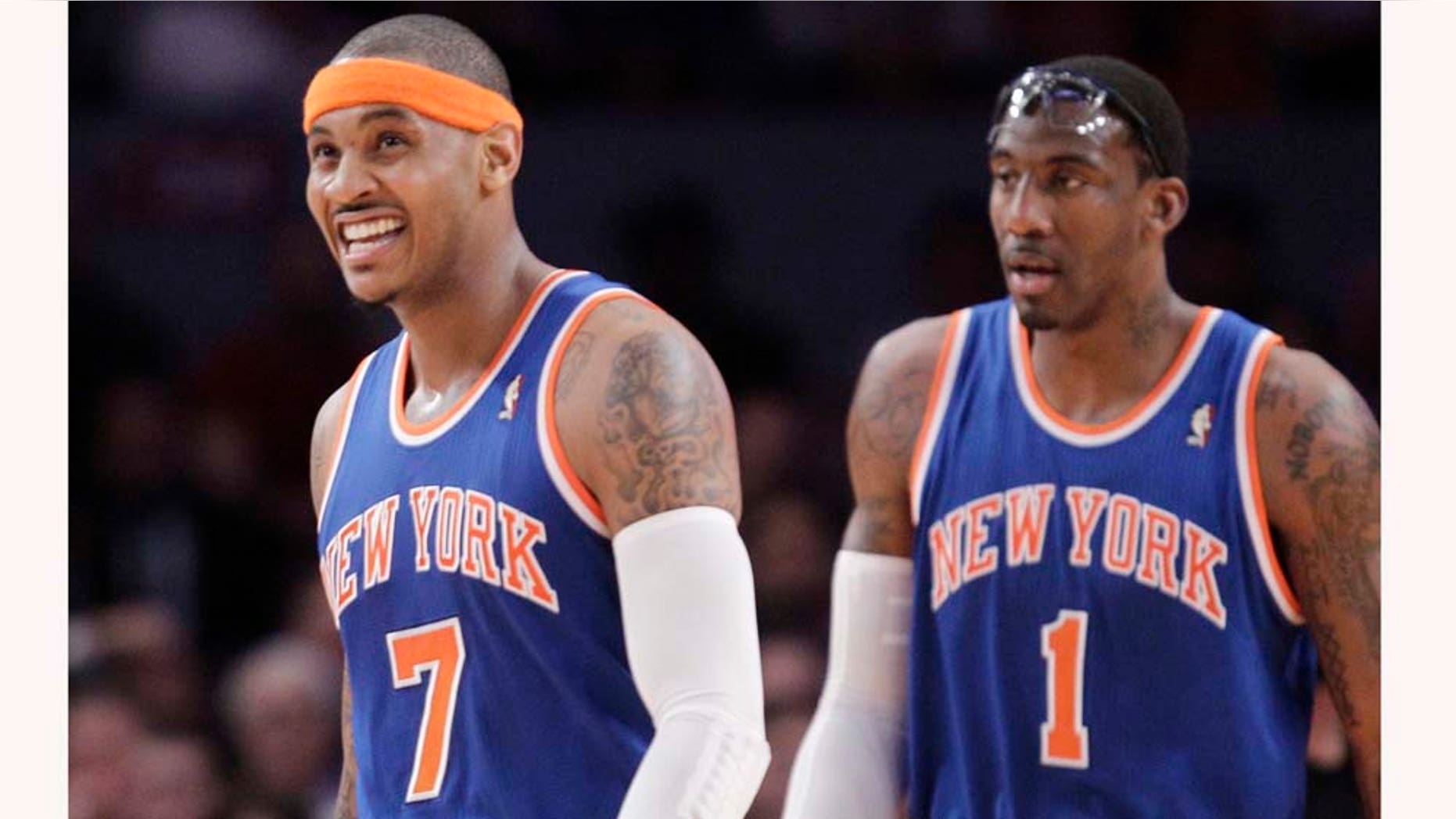 FILE - In this Feb. 23, 2011 file photo, New York Knicks' Carmelo Anthony (7) and Amare Stoudemire (1) walk during a break in play in the first half of an NBA basketball game, in New York. The New Jersey Nets wonât move to Brooklyn for a year and a half, but with the Nets and New York Knicks battling over marquee players like Carmelo Anthony and erecting in-your-face billboards next to each otherâs arenas, some fans are already talking about reviving a Brooklyn-Manhattan sports rivalry thatâs been dormant since baseballâs Giants and Dodgers left after the 1957 season. (AP Photo/Kathy Willens, file)