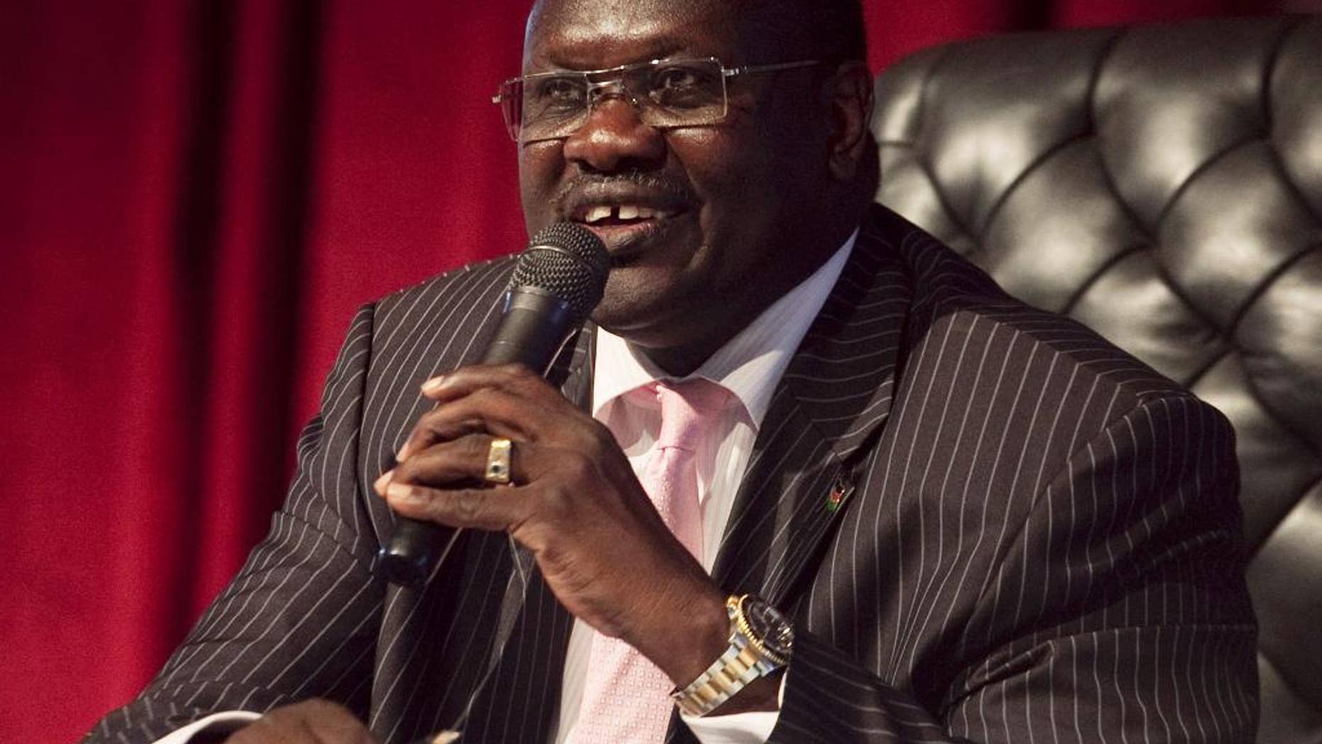 FILE - In this Wednesday, Oct. 13, 2010 file photo, Dr. Riek Machar, Vice President of the Government of South Sudan, presides over an all-southern-parties meeting in Juba, Sudan South. Sudan's political limbo continued Friday, Aug. 19, 2016 after rebel leader Riek Machar fled the country earlier in the week. Last month government and rebel forces clashed in the capital, killing hundreds of civilians and Machar was controversially removed as First Vice President. Machar's departure puts South Sudan's peace deal into disarray at the same time the country is suffering from a humanitarian crisis. (AP Photo/Pete Muller, file)