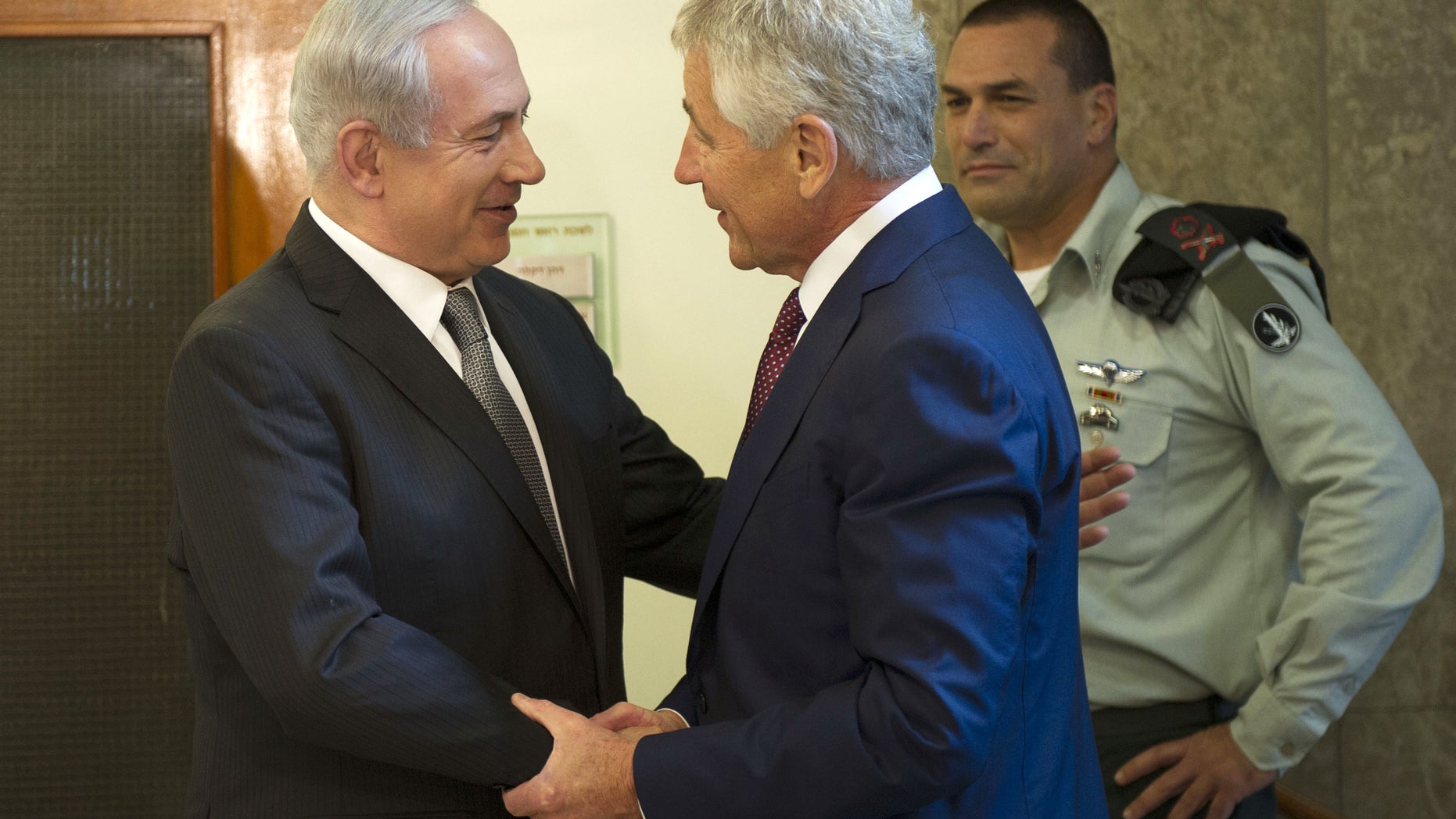 Israeli Prime Minister Benjamin Netanyahu, left, welcomes U.S. Secretary of Defense Chuck Hagel at his office in Jerusalem, on Tuesday, April 23, 2013. Hagel said the U.S. and Israel need to ensure that their alliance is "closer than ever," as Mideast security challenges grow more complicated. (AP Photo/Jim Watson, Pool)