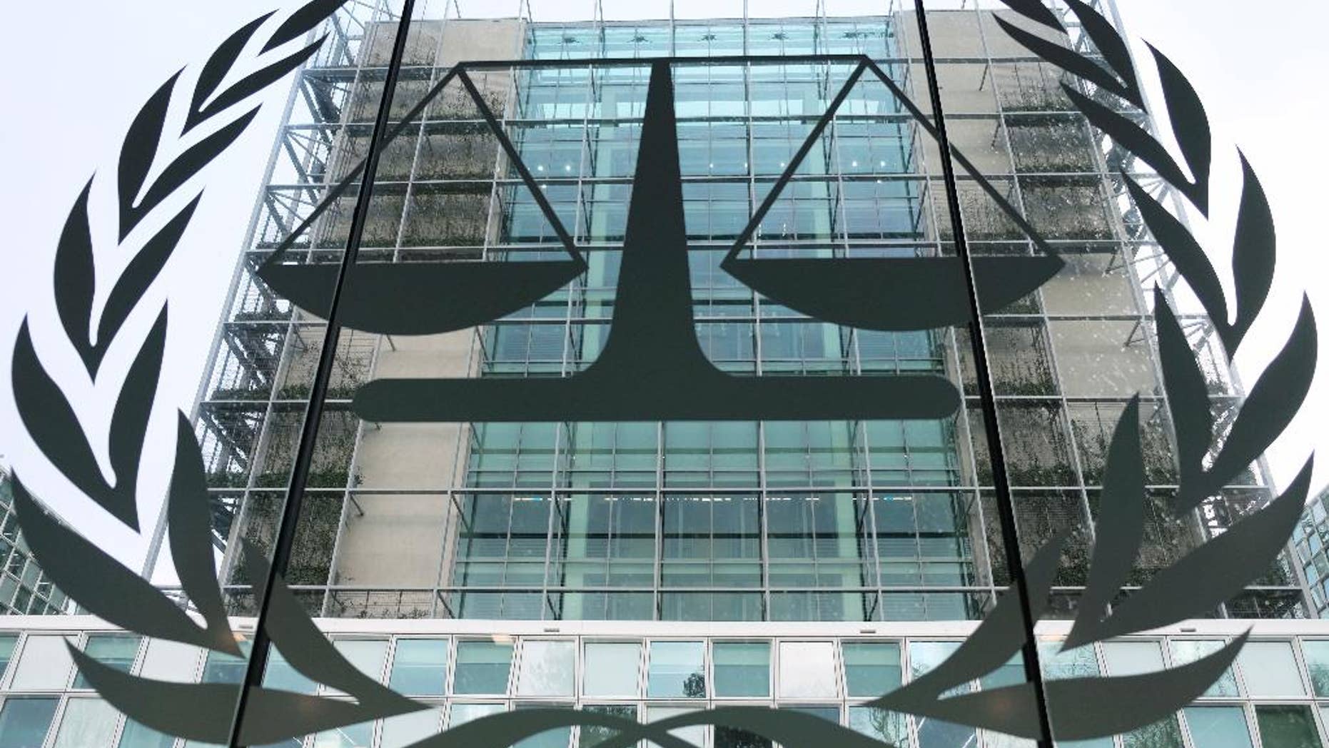 FILE- This Jan. 12, 2016, file photo shows the exterior view of the headquarters of the International Criminal Court in The Hague, Netherlands. U.S. armed forces and the CIA may have committed war crimes by torturing detainees in Afghanistan, the International Criminal Court's chief prosecutor said in a report Monday, Nov. 14, 2016, raising the possibility that American citizens could be indicted even though Washington has not joined the global court. (AP Photo/Mike Corder, File)