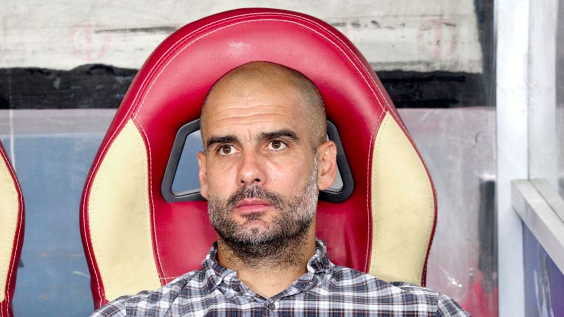 GUANGZHOU, CHINA - JULY 23: (CHINA OUT) Josep Guardiola, head coach of FC Bayern Muenchen, looks on during the international friendly match between Guangzhou Evergrande and FC Bayern Muenchen of the Volkswagen Cup Guangzhou at Tianhe Stadium on July 23, 2015 in Guangzhou, China. (Photo by ChinaFotoPress/ChinaFotoPress via Getty Images)