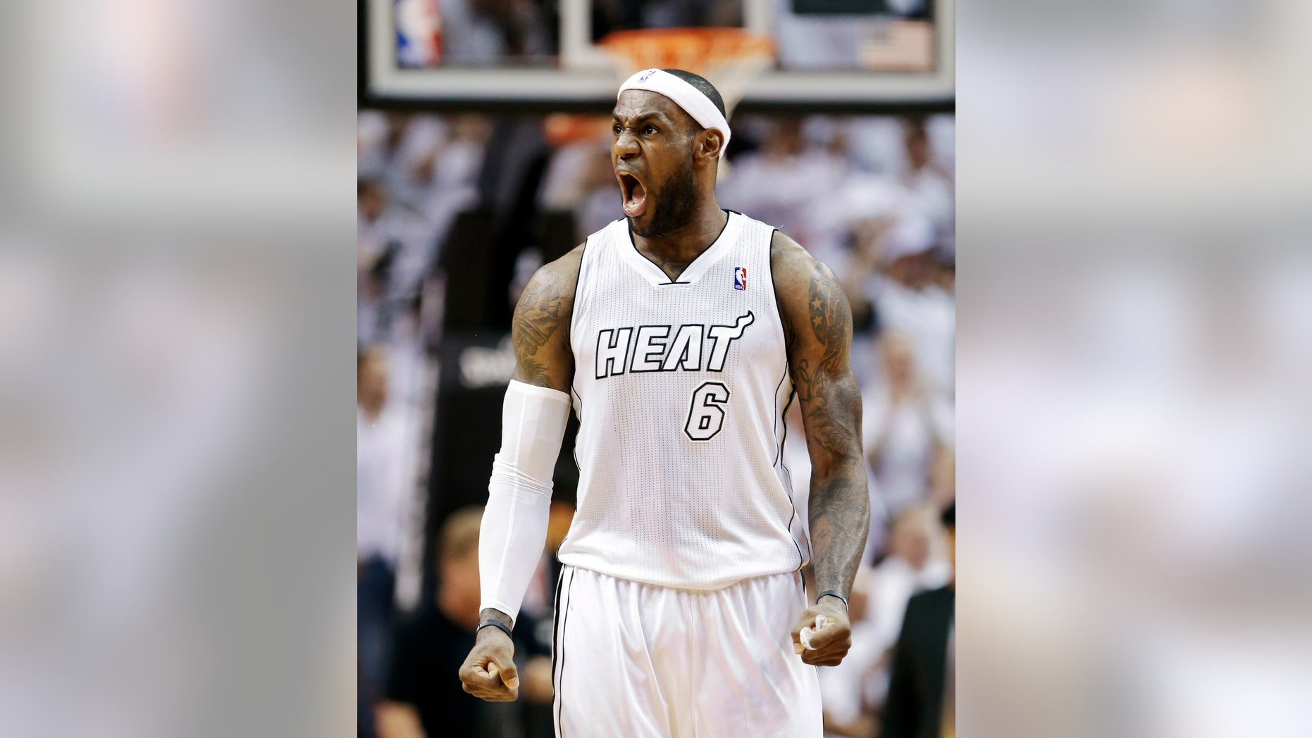 FILE - In this April 23, 2013, file photo, Miami Heat forward LeBron James celebrates after a play during the second half of Game 2 in their first-round NBA basketball playoff series against the Milwaukee Bucks in Miami. A person with knowledge of the situation tells The Associated Press that James has won the NBA Most Valuable Player award for the fourth time in five years. (AP Photo/Wilfredo Lee, File)