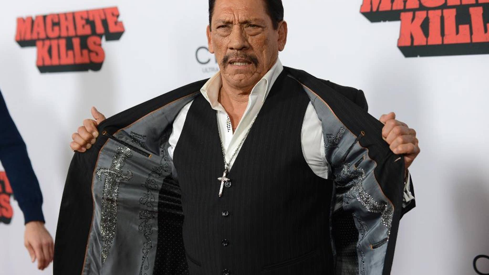 FILE - In this Oct. 2, 2013, file photo, actor Danny Trejo arrives at the premiere of "Machete Kills" at Regal Cinemas L.A. Live in Los Angeles. The Los Angeles Times reports Trejo took the floor at a community meeting at Sylmar High School in Los Angeles on May 11, 2016, following a brawl at the school. (Photo by Jordan Strauss/Invision/AP, File)