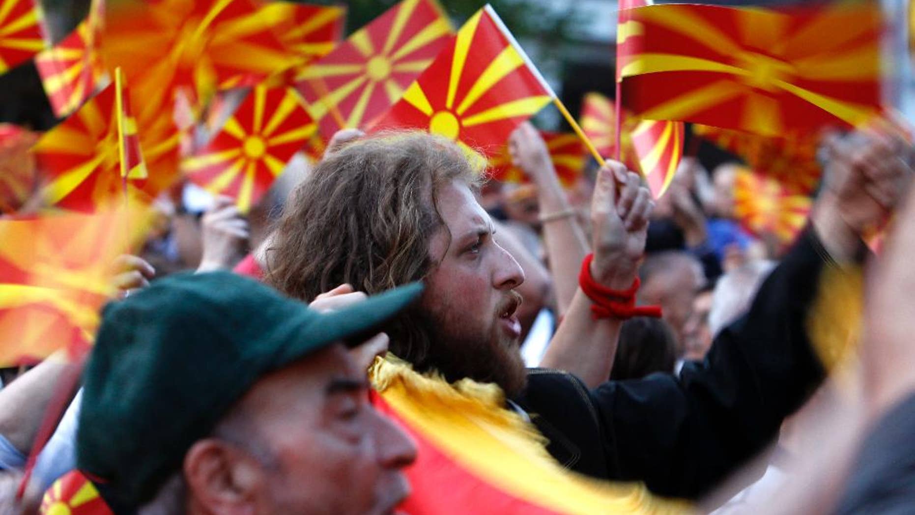 People wave Macedonian flags during a paceful protest in front of the EU mission building in Skopje, Macedonia, Friday, April 28, 2017.
About 2,000 protesters have gathered in Macedonia’s capital Skopje to demand new elections to try and break the country’s political deadlock, a day after violent protests inside the country’s parliament. (AP Photo/Boris Grdanoski)