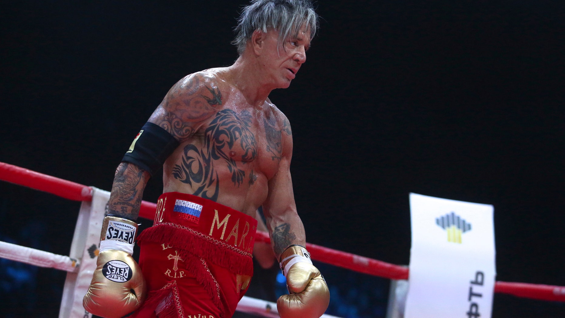 Nov. 28, 2014. Mickey Rourke approaches his opponent Elliot Seymour of the United States, during their professional boxing match at the Luzhniki Stadium, in Moscow, Russia.