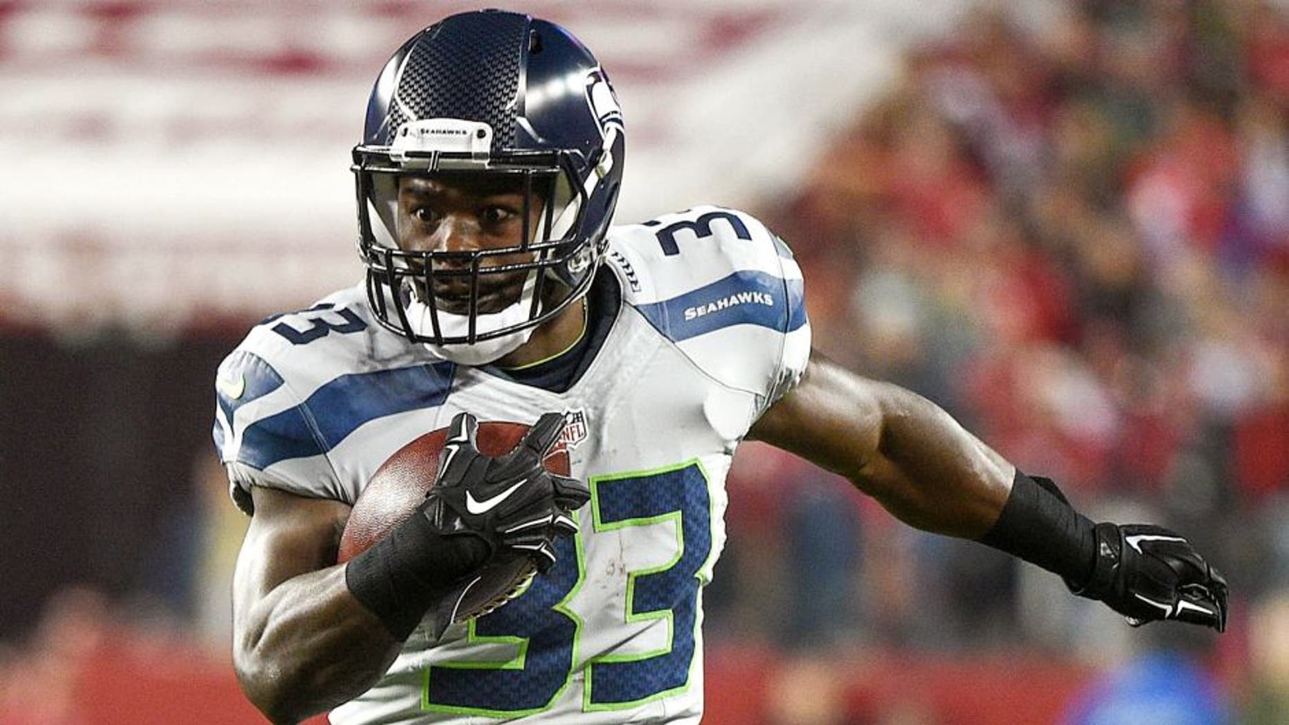 November 27, 2014; Santa Clara, CA, USA; Seattle Seahawks running back Christine Michael (33) runs with the football during the second quarter against the San Francisco 49ers at Levi's Stadium. The Seahawks defeated the 49ers 19-3. Mandatory Credit: Kyle Terada-USA TODAY Sports