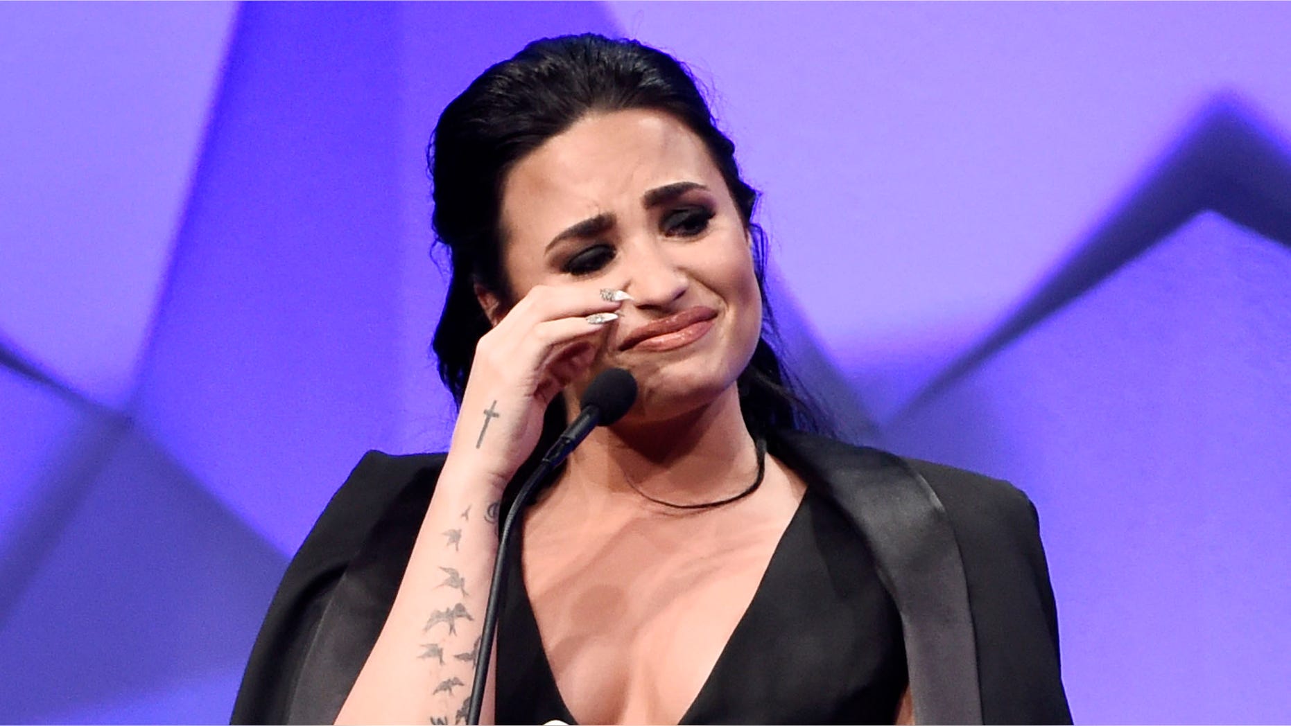 Singer Demi Lovato becomes emotional as she accepts the Vanguard Award during the 27th Annual GLAAD Media Awards at the Beverly Hilton on Saturday, April 2, 2016, in Beverly Hills, Calif. (Photo by Chris Pizzello/Invision/AP)