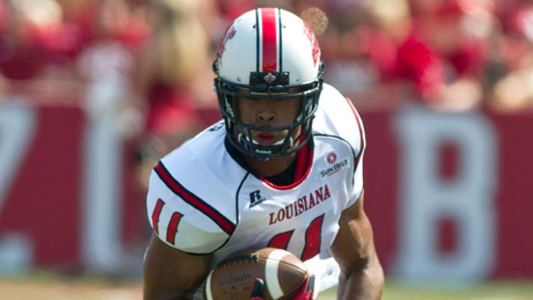 Aug 31, 2013; Fayetteville, AR, USA; Louisiana Ragin' Cajuns wide receiver James Butler (11) runs the ball during the first half of a game against the Arkansas Razorbacks at Donald W. Reynolds Razorback Stadium. Arkansas defeated Louisiana 34-14. Mandatory Credit: Beth Hall-USA TODAY Sports