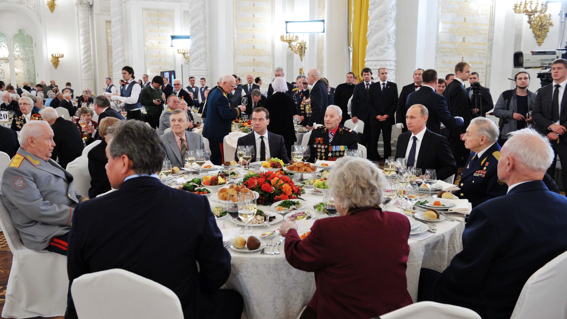 Russian President Vladimir Putin, third right, and Prime Minister Dmitry Medvedev, center back, meet with World War II veterans at a reception marking the 70th anniversary of the Battle of Stalingrad, in the Kremlin in Moscow, Friday, Feb. 1, 2013. The Battle of Stalingrad was a turning point in World War II that led to the defeat of the Nazi Germany in the east. (AP Photo/RIA-Novosti, Alexei Nikolsky, Presidential Press Service)
