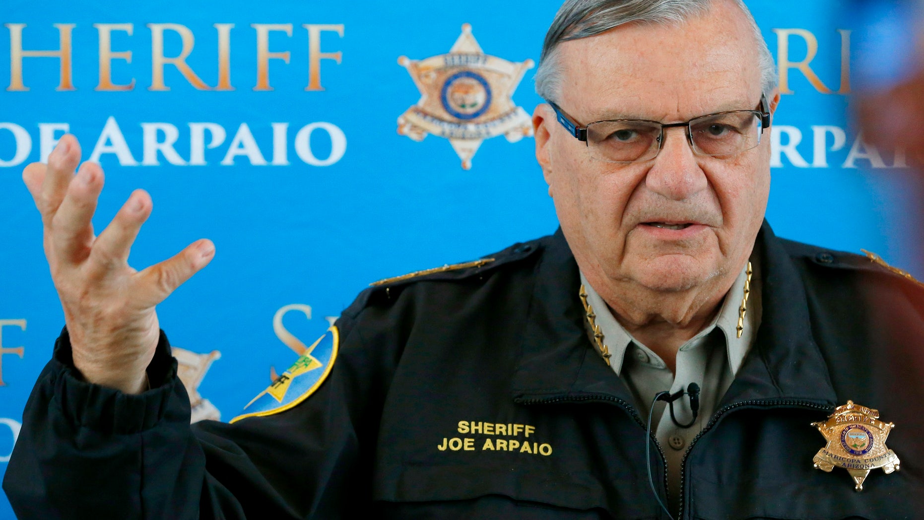 FILE - In this Dec. 18, 2013 file photo, Maricopa County Sheriff Joe Arpaio announces dozens of arrests in a prostitution sting during a news conference at Maricopa County Sheriff's Office Headquarters in Phoenix. Arpaio, who has often clashed with the federal government over the enforcement of immigration laws has filed a lawsuit to stop new policies announced by President Barack Obama. The suit filed Thursday, Nov. 20, 2014 in federal court in Washington on behalf of Maricopa County Sheriff Joe Arpaio contends Obama acted outside his constitutional authority by not going through Congress. (AP Photo/Ross D. Franklin)