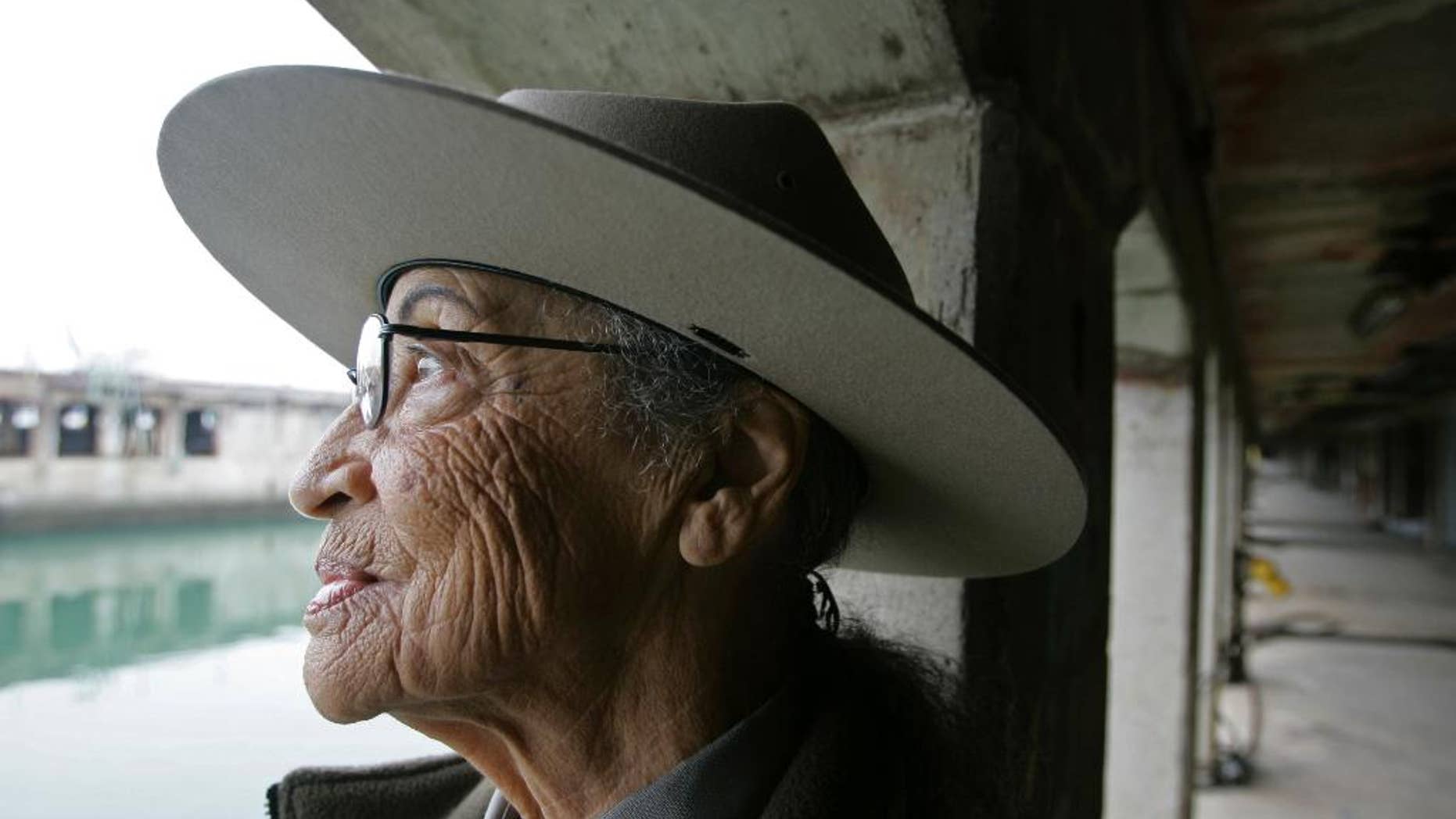 This Oct. 31, 2007 file photo Betty Reid Soskin, a community outreach worker at the Rosie the Riveter/World War II Home Front National Historic Park, looks out at the water from a dry dock area where woman worked during the war in Richmond, Calif.