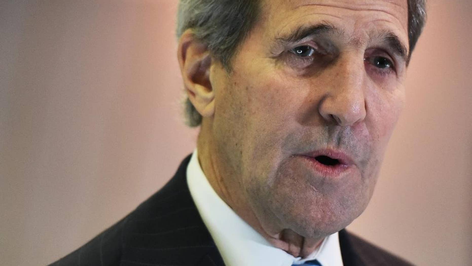US Secretary of State John Kerry speaks to reporters following a meeting with France's Foreign Minister Laurent Fabius on the sidelines of the COP 21 United Nations conference on climate change, in Le Bourget, on the outskirts of Paris on Friday Dec. 11, 2015. (Mandel Ngan, Pool via AP)