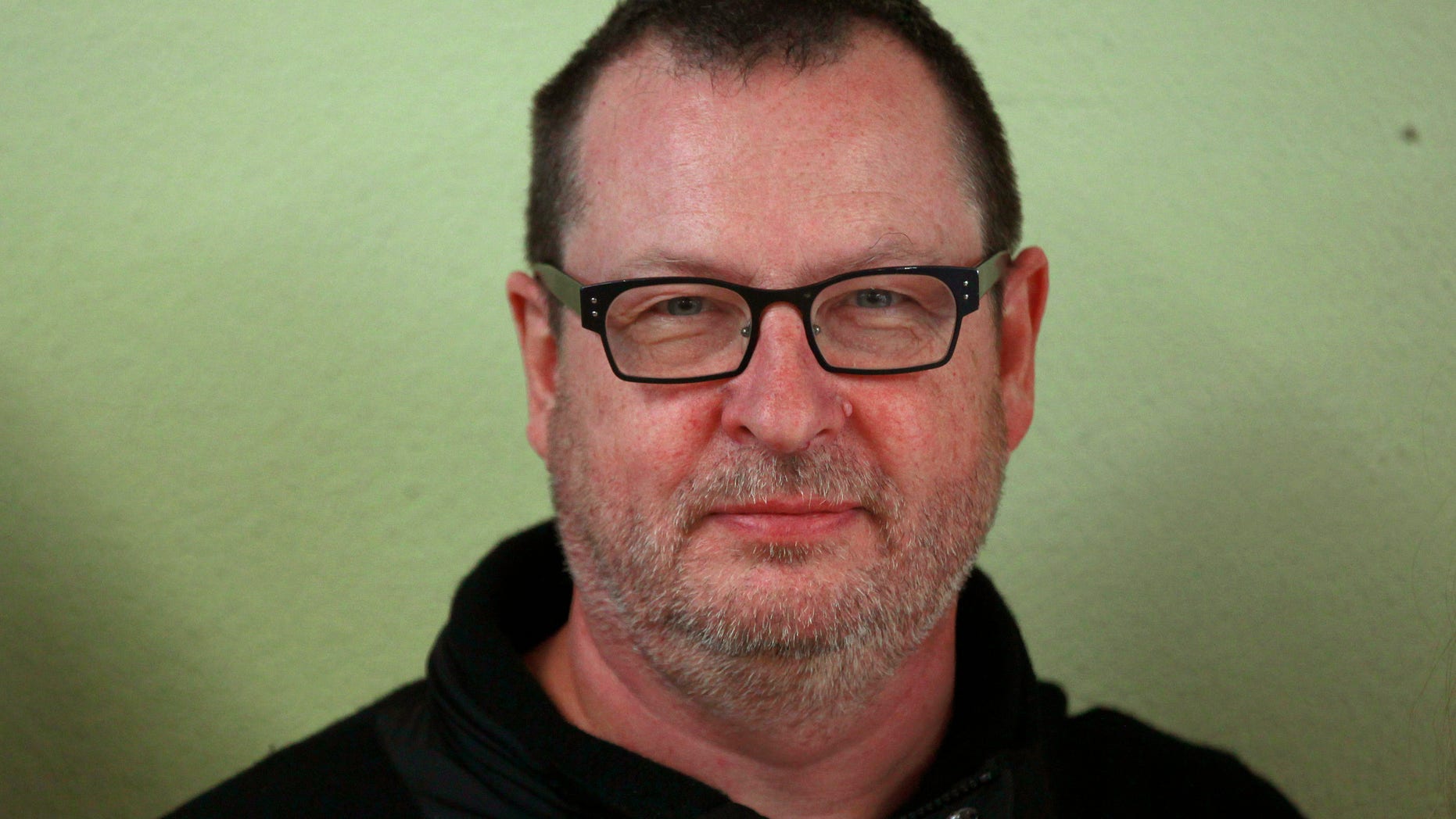 Director Lars Von Trier poses on the film set of 'Nymphomaniac' at a former primary school in Cologne September 20, 2012. The film will chronicle the sexual adventures of a woman played by actress Charlotte Gainsbourg from her youth through age 50 with actor Stellan Skarsgard playing her husband. REUTERS/Ina Fassbender (GERMANY - Tags: ENTERTAINMENT HEADSHOT) - RTR3872U