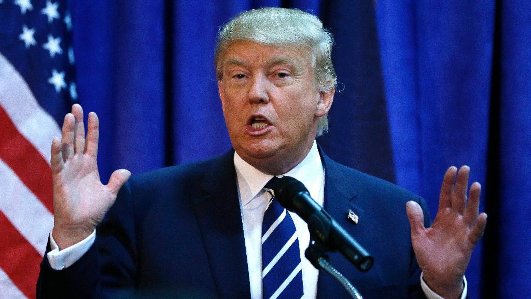 Republican presidential candidate Donald Trump meets the media before addressing a GOP fundraising event, Tuesday, Aug. 11, 2015, in Birch Run, Mich. Trump attended the Lincoln Day Dinner of the Genesee and Saginaw county Republican parties. (AP Photo/Carlos Osorio)