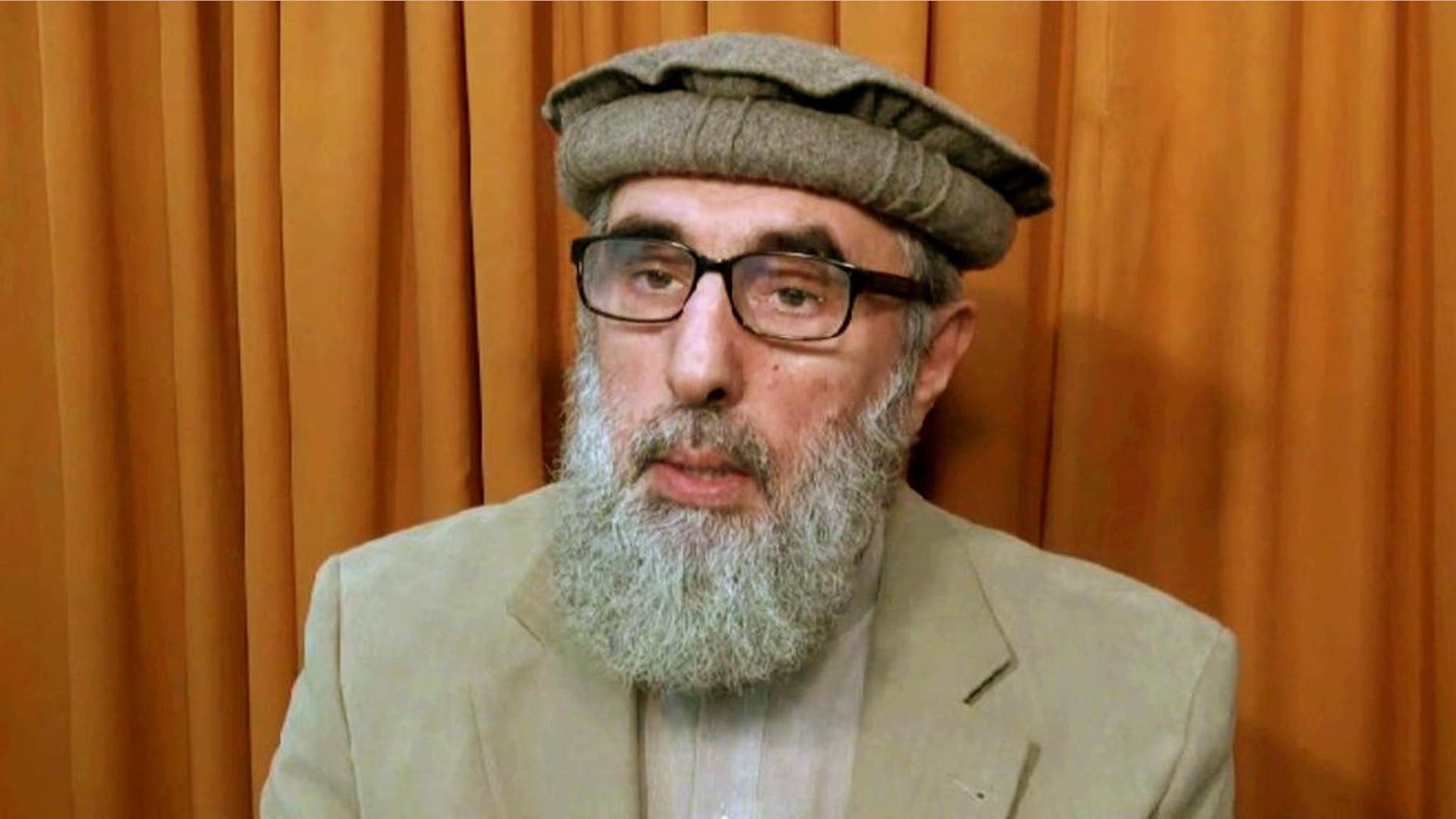 FILE - This file image made from video released to the Associated Press during the week of Nov. 21, 2015 shows Afghan warlord Gulbuddin Hekmatyar, now in his late 60s, in an undisclosed location. The United Nations removed the name of the former Afghan warlord from its Islamic State group and al-Qaida sanctions list. According to a statement posted Friday, Feb. 3, 2017, by the Security Council, a U.N. committee removed Gulbuddin Hekmatyar's name from the sanctions list. (AP photo via AP video, File)