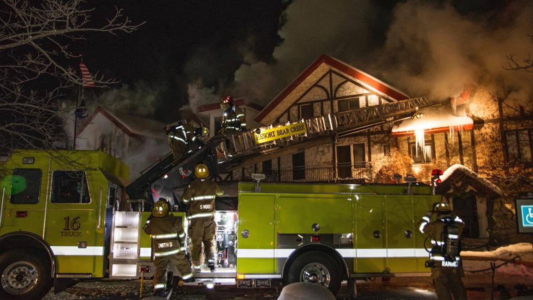 Firefighters extinguish a blaze Sunday, Dec. 11, 2016, at Boyne Highlands Resort in Harbor Springs, Mich. The resort called it a "significant structure fire" early Sunday. (Alex Childress Photo via AP)