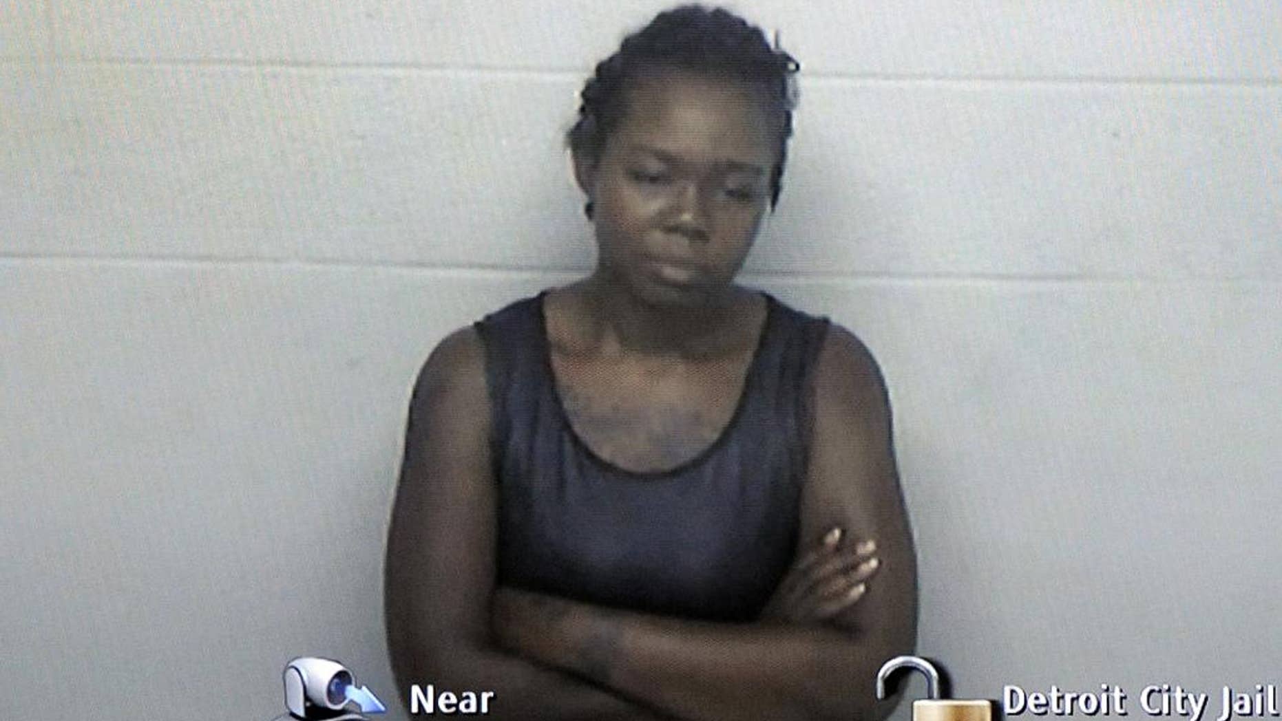 In this Aug. 4, 2016 photo provided by the Detroit City Jail, Deanna Minor appears in a video arraigned from Detroit City Jail in the 36th District Court of Magistrate Bari Blake Wood in Detroit. A judge has found Minor on Wednesday, Nov. 30, 2016, incompetent to stand trial in the death of her son whose decomposing body was found in their Detroit apartment while she was in psychiatric care. (Detroit City Jail/Detroit News via AP)