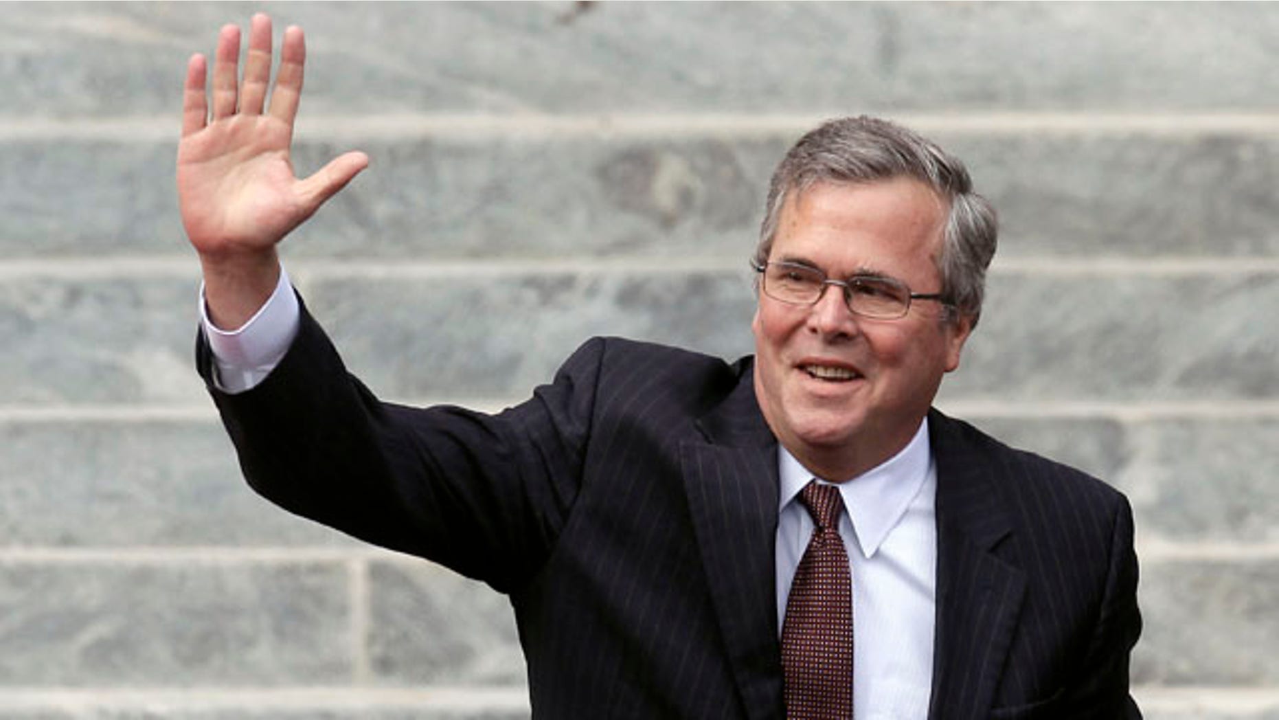 Former Florida Gov. Jeb Bush waves as he is introduced to the crowd during inauguration ceremonies for Republican Rick Scott Tuesday, Jan. 4, 2011 outside the Old Capitol in Tallahassee, Fla. (AP Photo/Chris O'Meara)