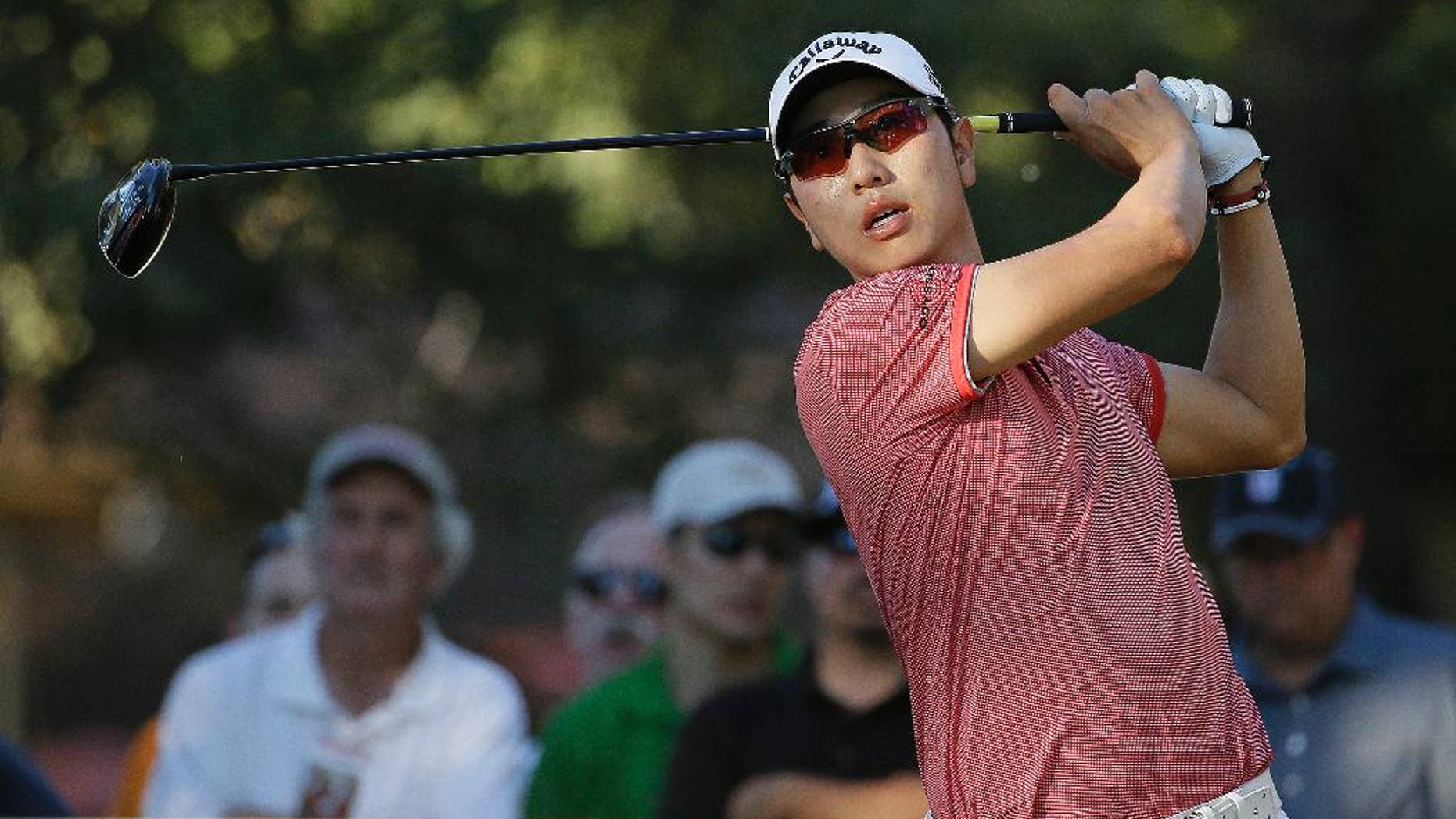 Bae Sang-Moon of South Korea follows his drive from the 18th tee of the Silverado Resort North Course during the final round of the Frys.com PGA Tour golf tournament Sunday, Oct. 12, 2014, in Napa, Calif. Bae Sang-Moon won the tournament after shooting a 1-over-par 73 to finish at total 15-under-par. (AP Photo/Eric Risberg)
