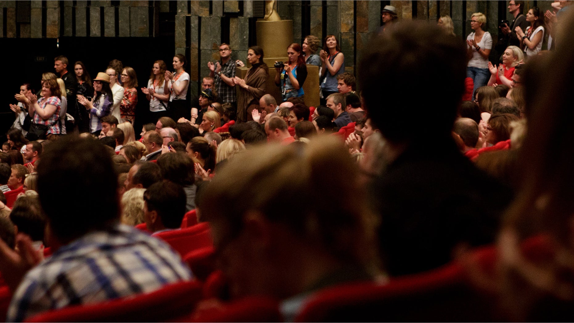 KARLOVY VARY, CZECH REPUBLIC - JULY 05: Audience applaud to makers of Czech film Revival after his premiere screening during the 48th Karlovy Vary International Film Festival (KVIFF) on July 05, 2013 in Karlovy Vary, Czech Republic. (Photo by Matej Divizna/Getty Images)