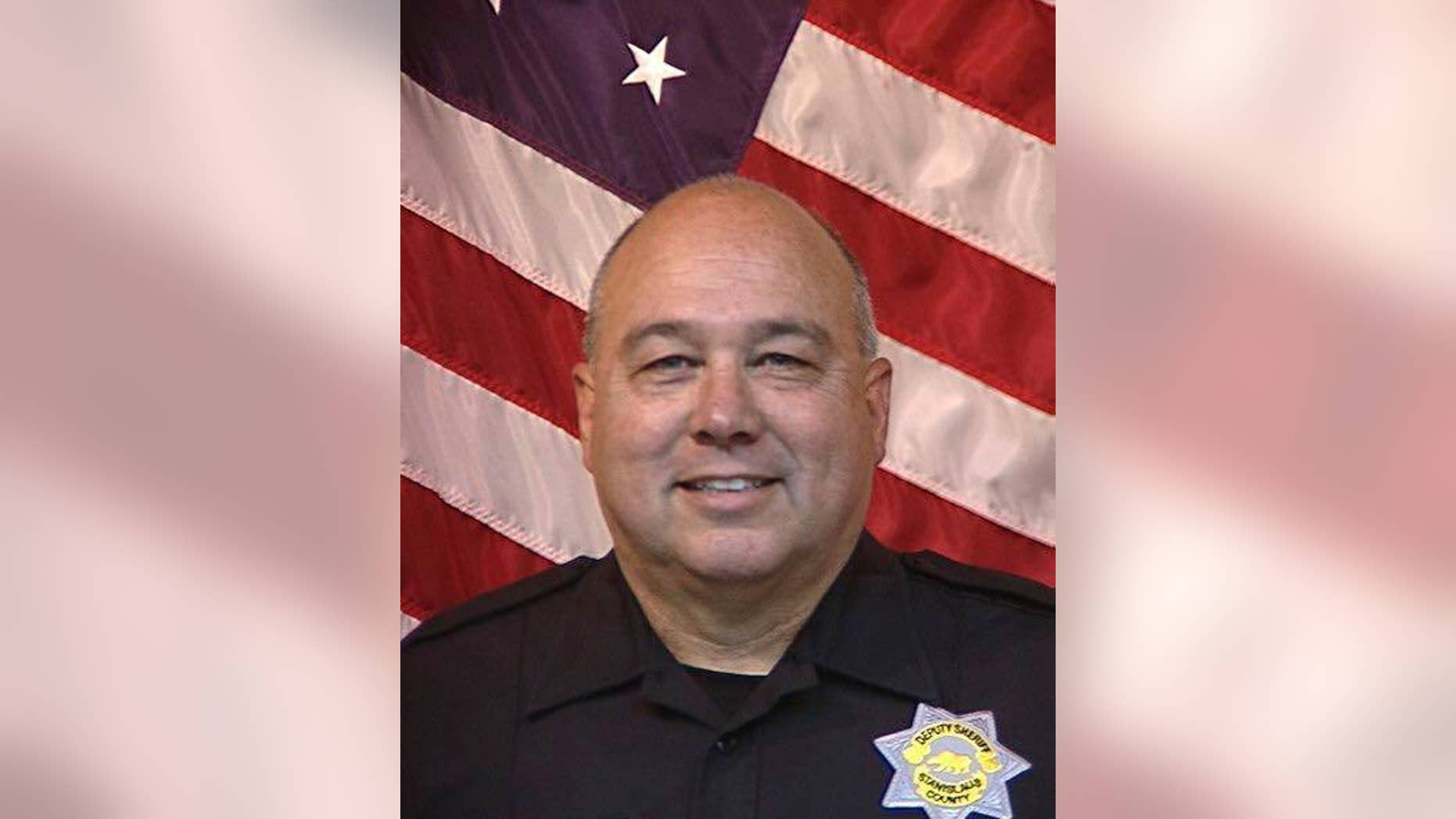 Stanislaus County Sheriff's Department Deputy Dennis Wallace is seen in an undated photo provided by the Stanislaus County, Calif., Sheriff's Department. The department says Deputy Dennis Wallace was shot and killed Sunday, Nov. 13, 2016, outside the city of Hughson, Calif., while checking on a suspicious car, and that 36-year-old suspect David Machado was arrested in Tulare County. (Stanislaus County Sheriff's Department via AP)
.