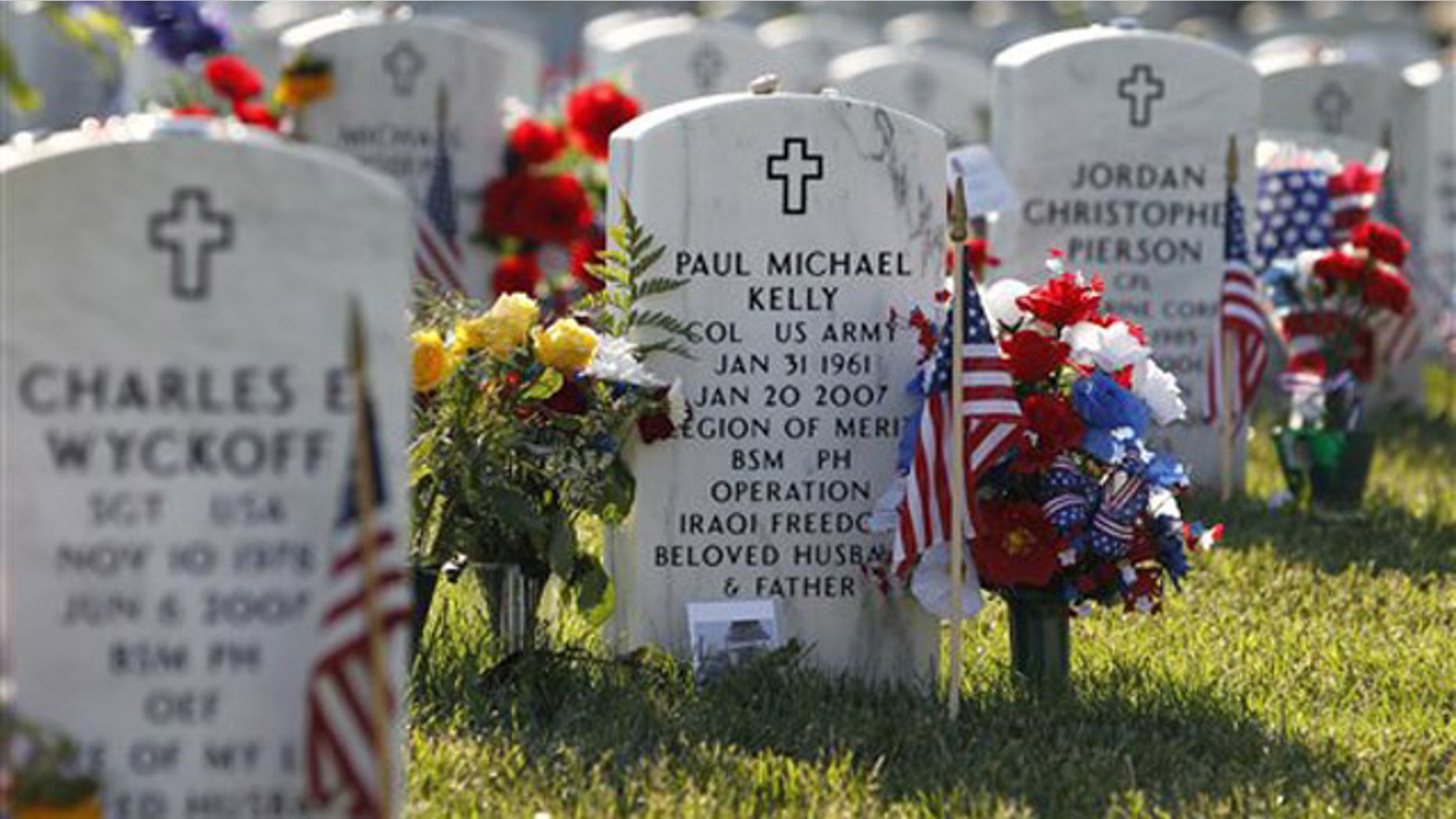 The headstone of Army Col. Paul Michael Kelly is seen at Arlington National Cemetery in Arlington, Va., where one lawmaker estimates up to 6,600 graves have been unmarked or improperly labeled.