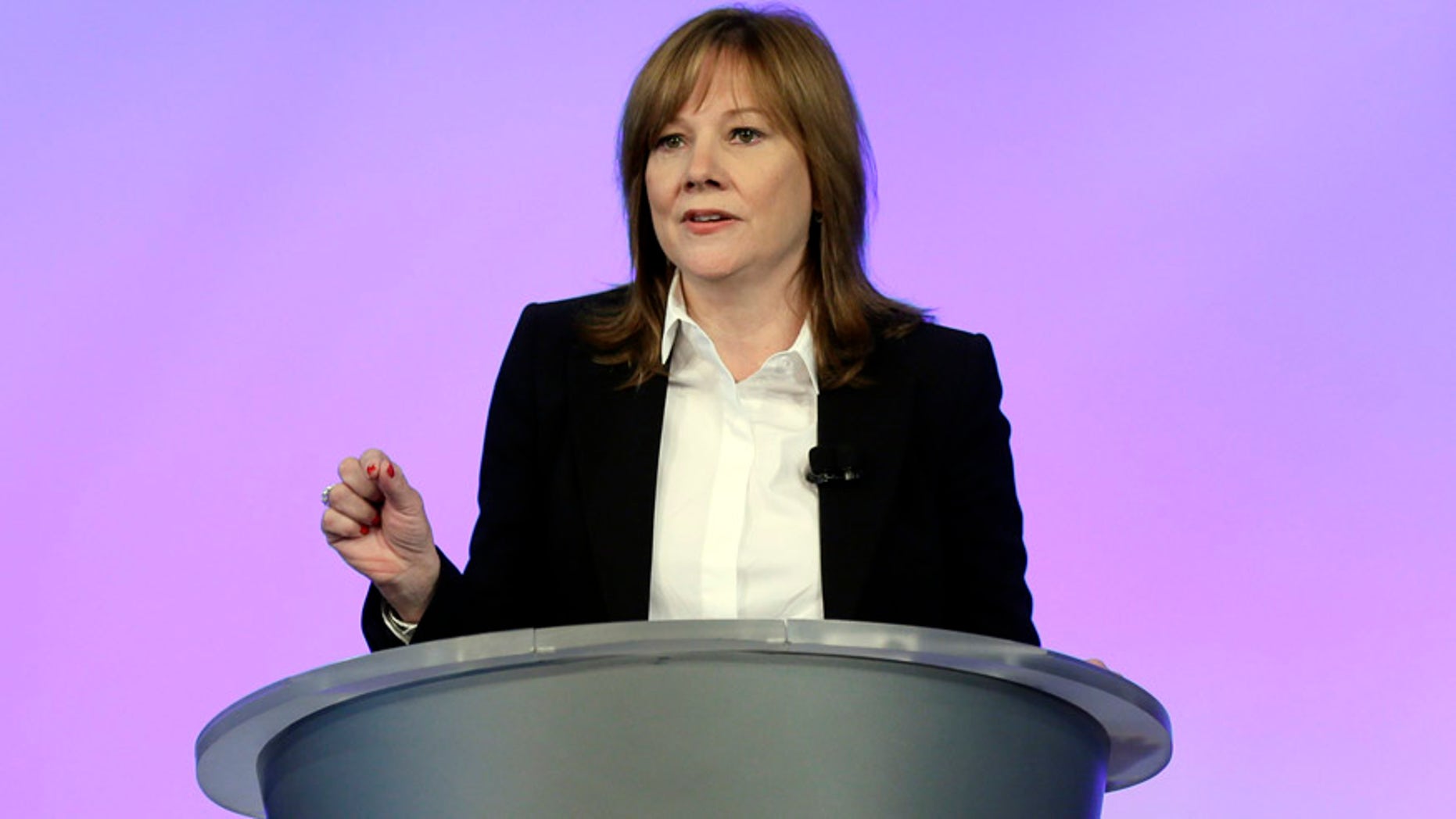General Motors CEO Mary Barra addresses employees at the automaker's vehicle engineering center in Warren, Mich., Thursday, June 5, 2014. Barra said 15 employees have been fired and five others have been disciplined over the company's failure to disclose a defect with ignition switches that is now linked to at least 13 deaths. (AP Photo/Carlos Osorio)