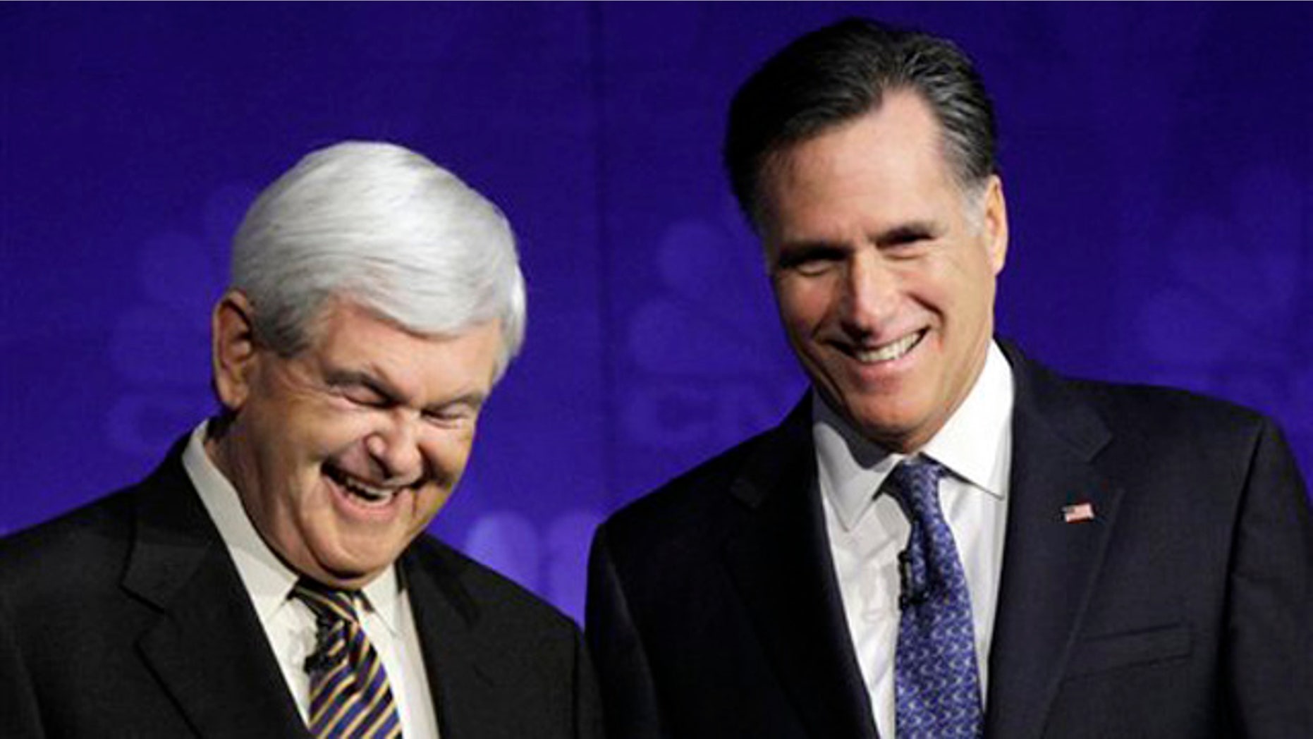 Nov. 9, 2011: Republican presidential candidates former House Speaker Newt Gingrich and former Massachusetts Gov. Mitt Romney laugh before a Republican presidential debate at Oakland University in Auburn Hills, Mich.
