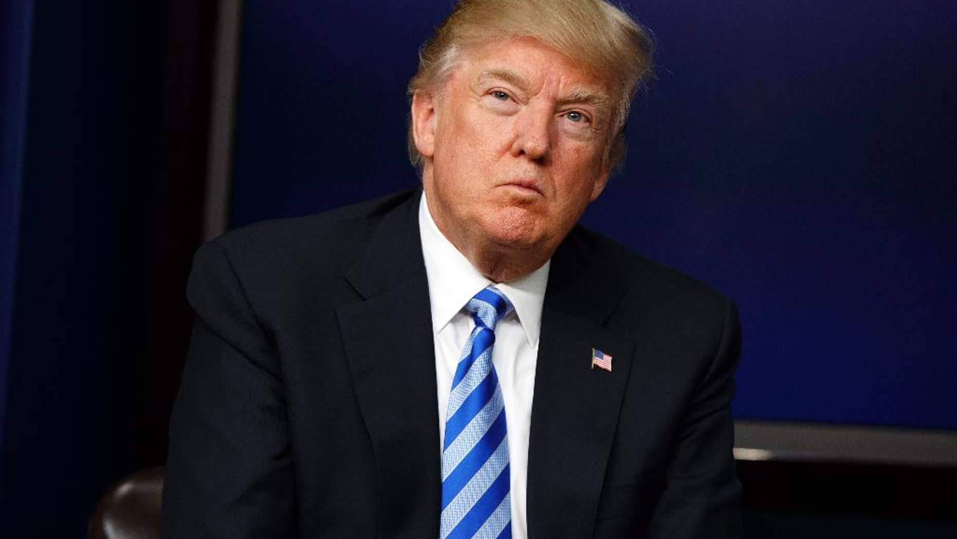 FILE - In this April 4, 2017, file photo, President Donald Trump listens to a question during a town hall with business leaders in the South Court Auditorium on the White House complex in Washington. The Trump administration will move forward with the sale of high-tech aircraft to Nigeria for its campaign against Boko Haram Islamic extremists despite concerns over abuses committed by the African nation’s security forces, according to U.S. officials. (AP Photo/Evan Vucci, File)